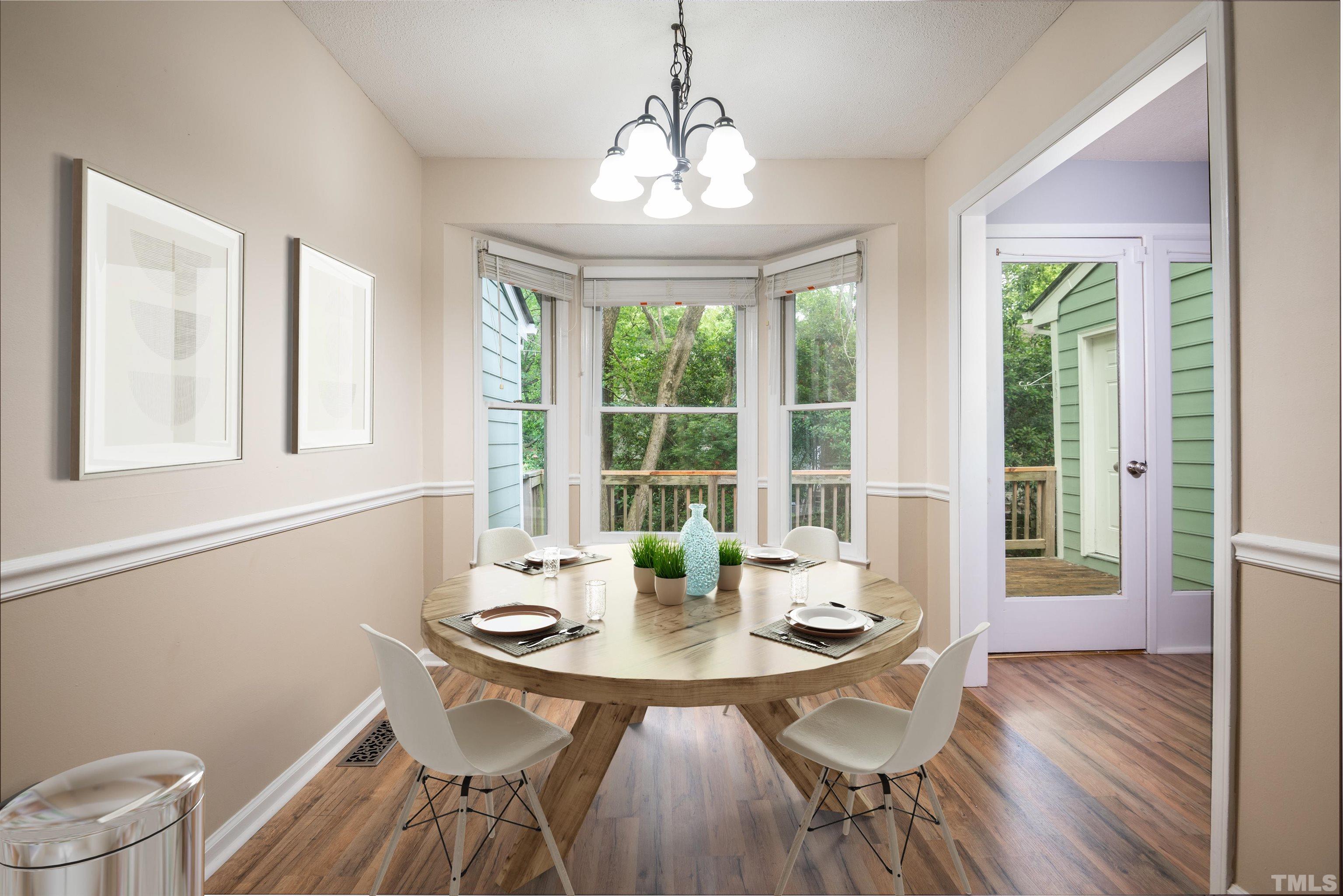 405 Oak Run Drive Raleigh, NC 27606 - Photo 14 of 83 a view of a dining room with furniture window and outside view
