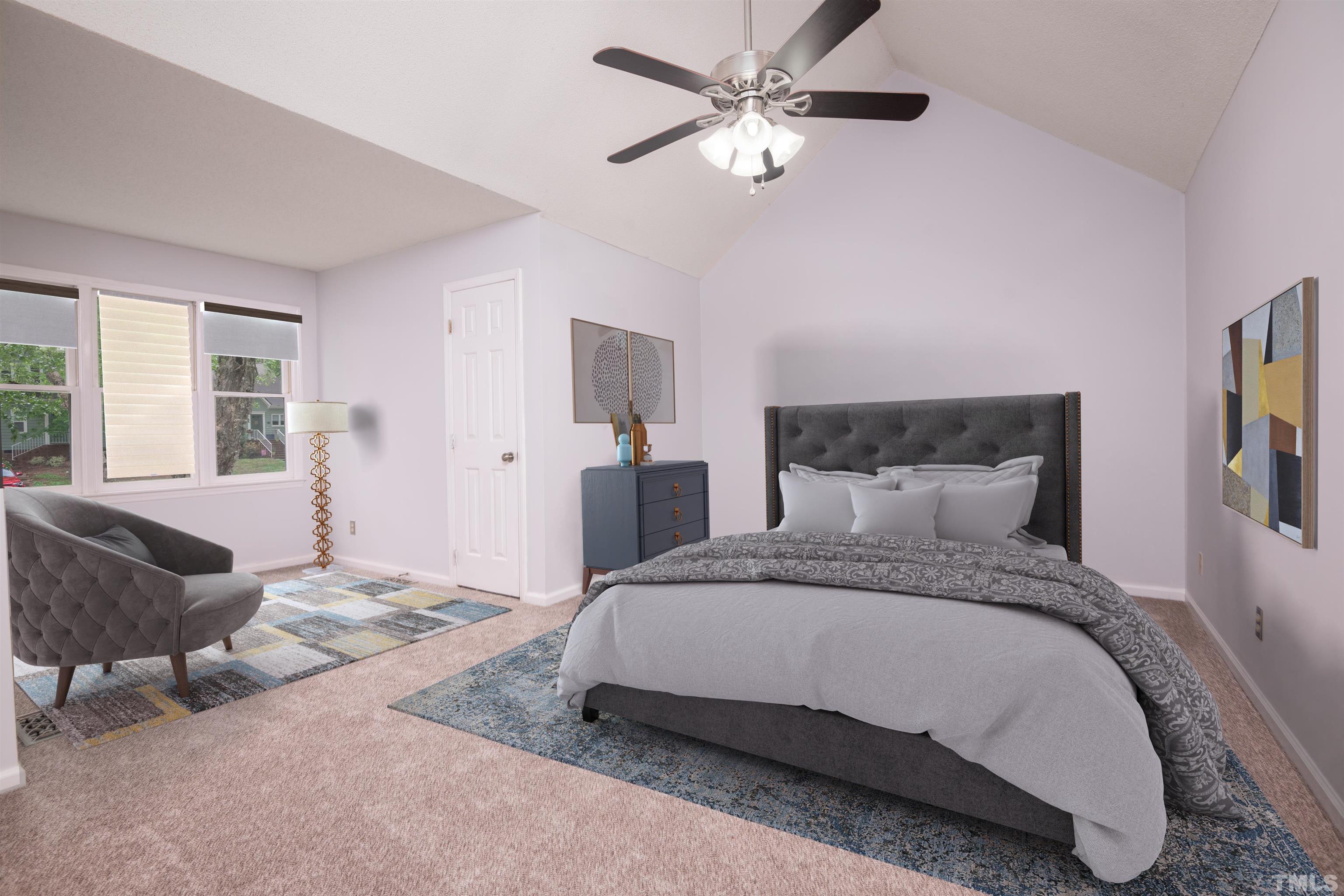 405 Oak Run Drive Raleigh, NC 27606 - Photo 24 of 83 a spacious bedroom with a bed and a couch