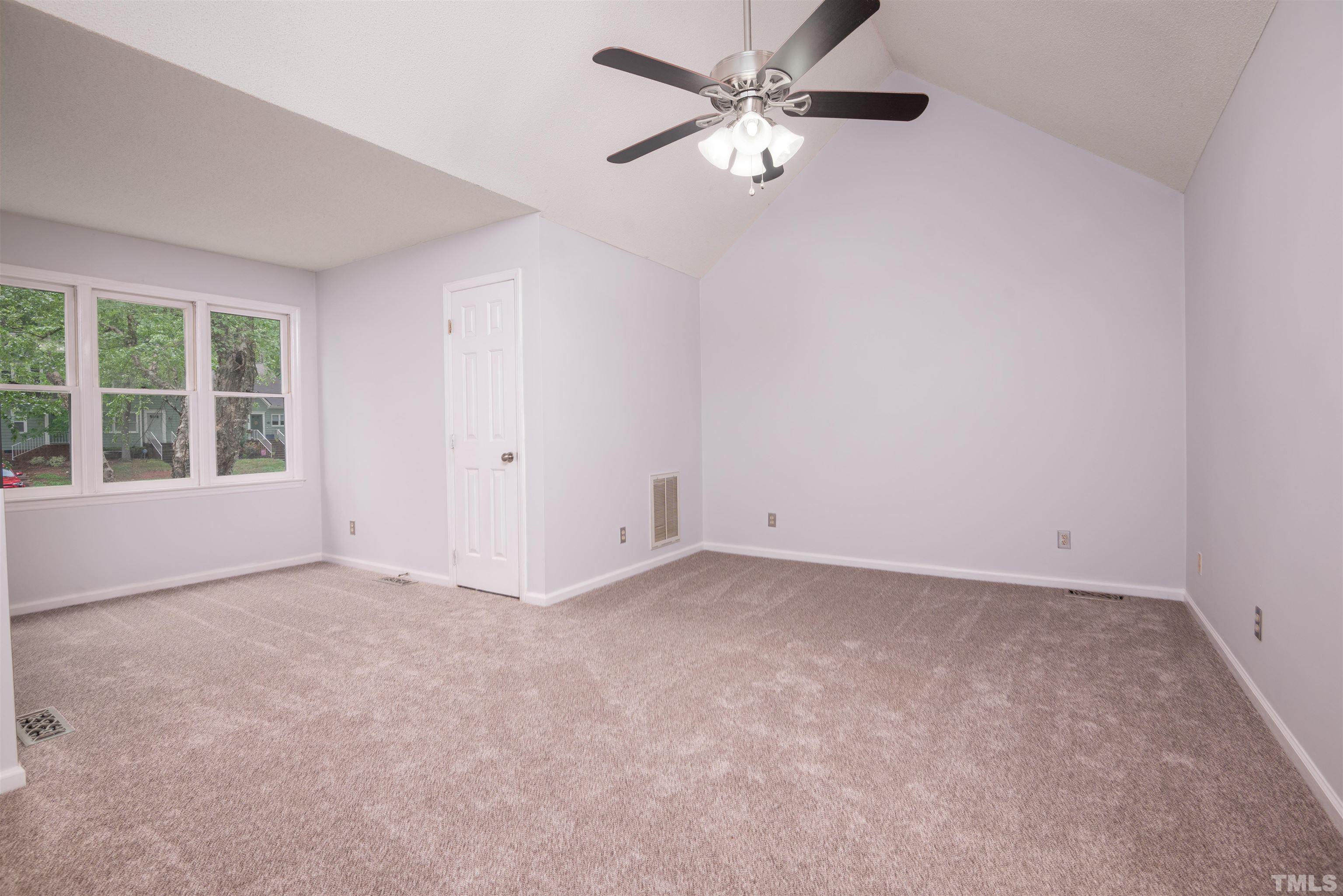 405 Oak Run Drive Raleigh, NC 27606 - Photo 25 of 83 an empty room with windows and fan