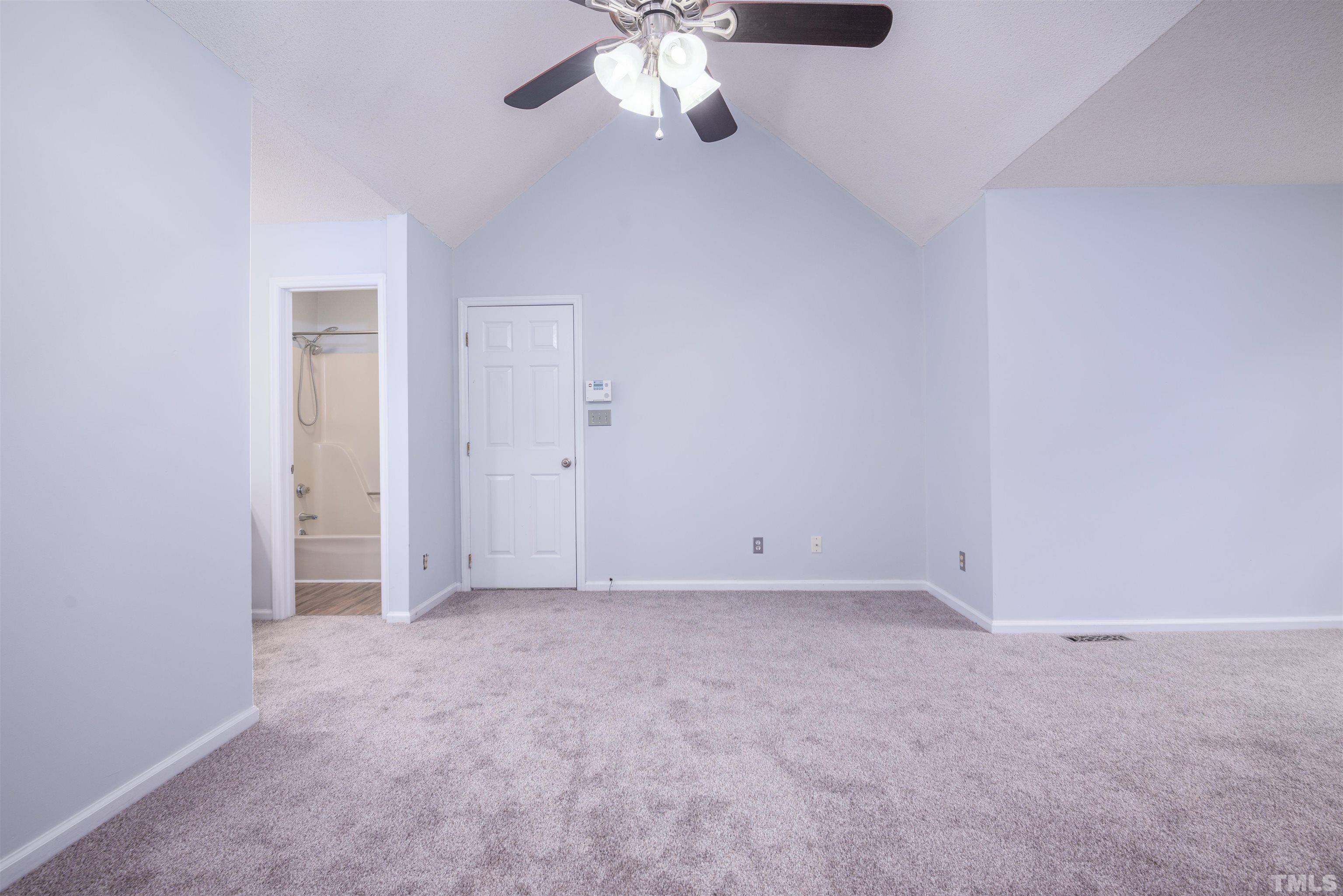 405 Oak Run Drive Raleigh, NC 27606 - Photo 29 of 83 a view of an empty room with a chandelier fan