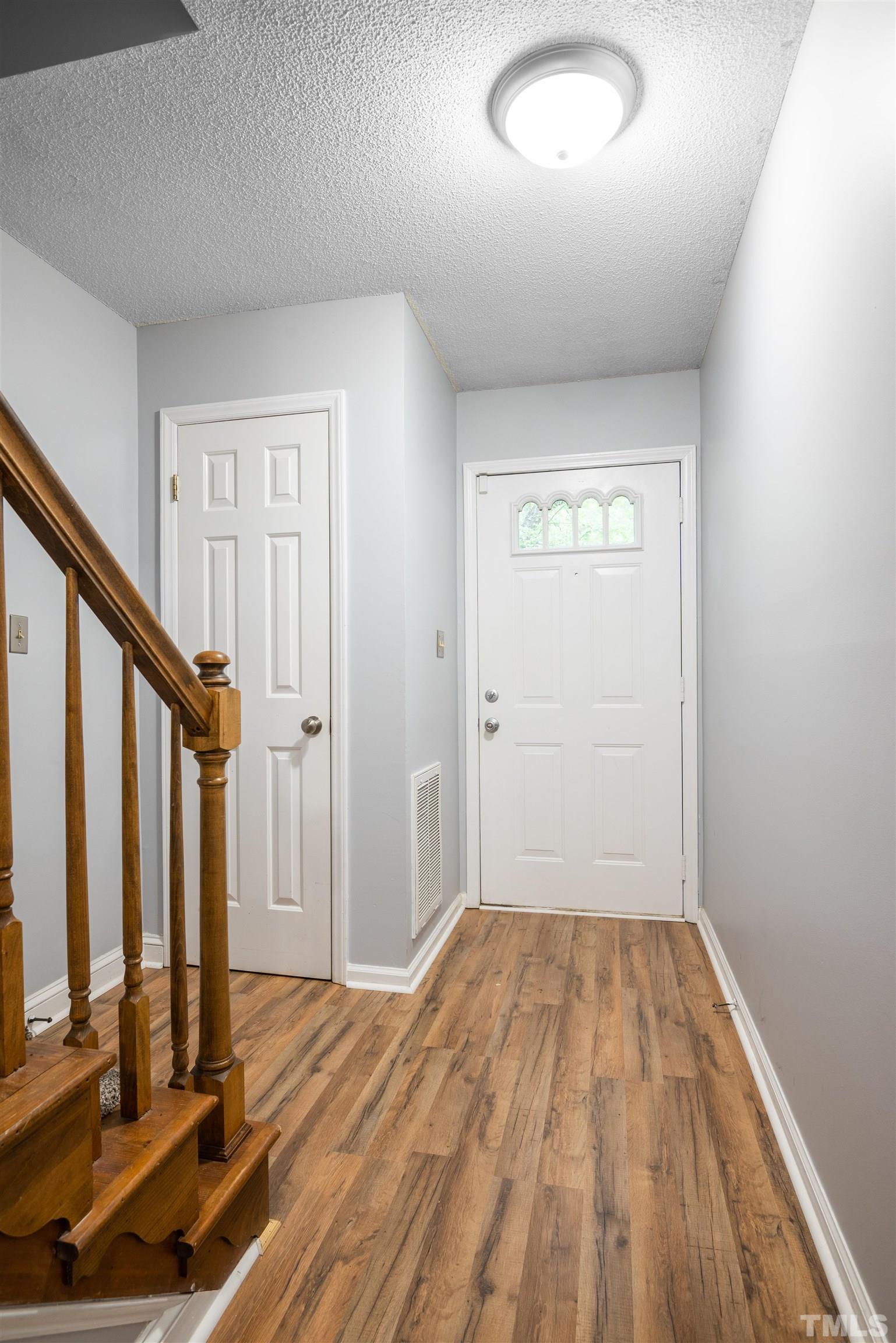 405 Oak Run Drive Raleigh, NC 27606 - Photo 3 of 83 a view of a room with wooden floor and staircase