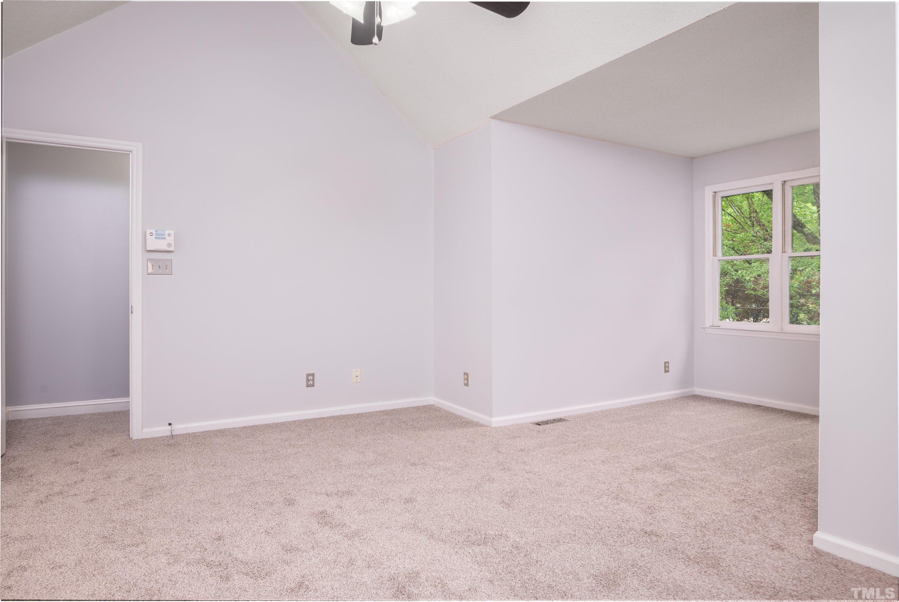 405 Oak Run Drive Raleigh, NC 27606 - Photo 31 of 83 an empty room with a window