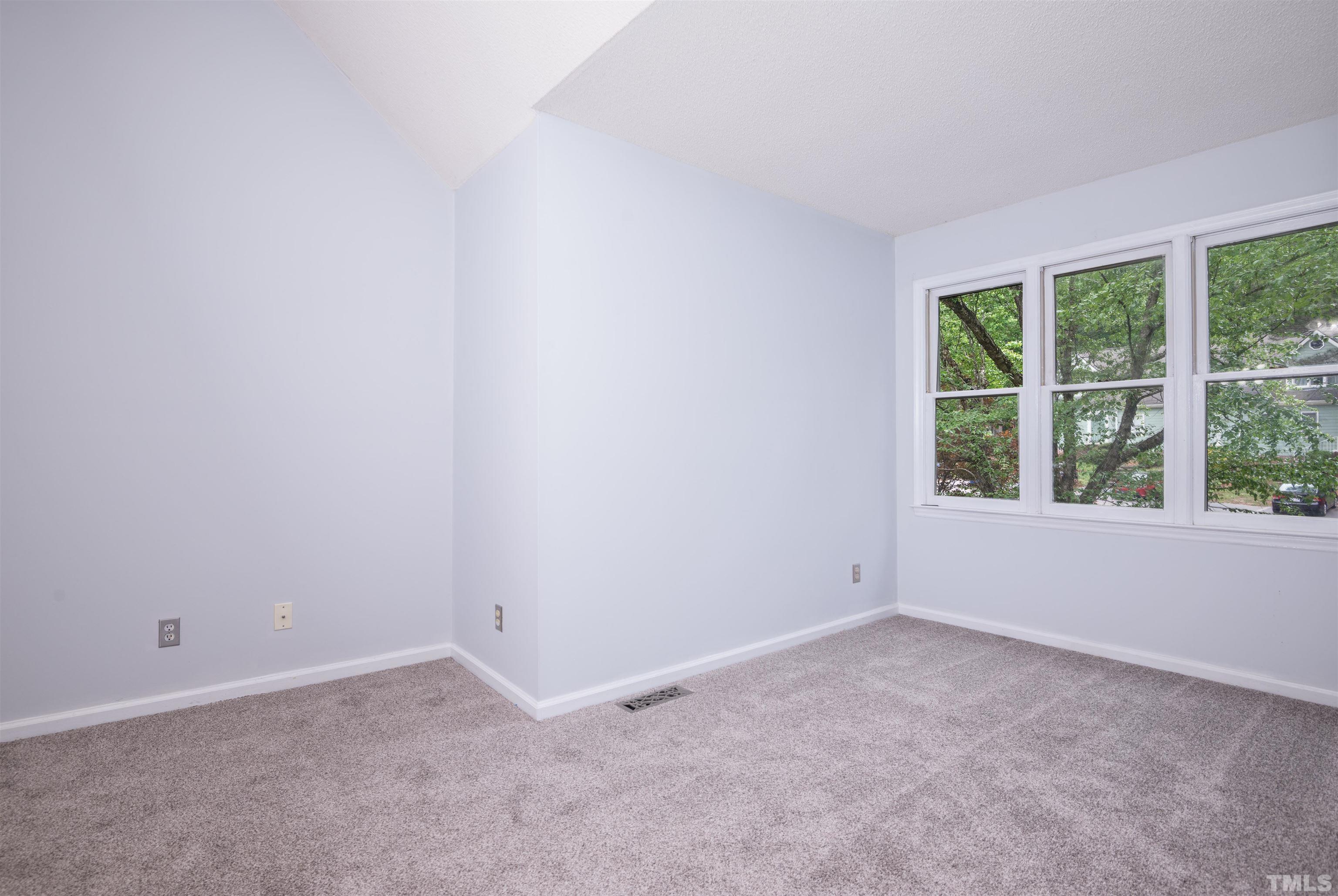 405 Oak Run Drive Raleigh, NC 27606 - Photo 33 of 83 an empty room with a window