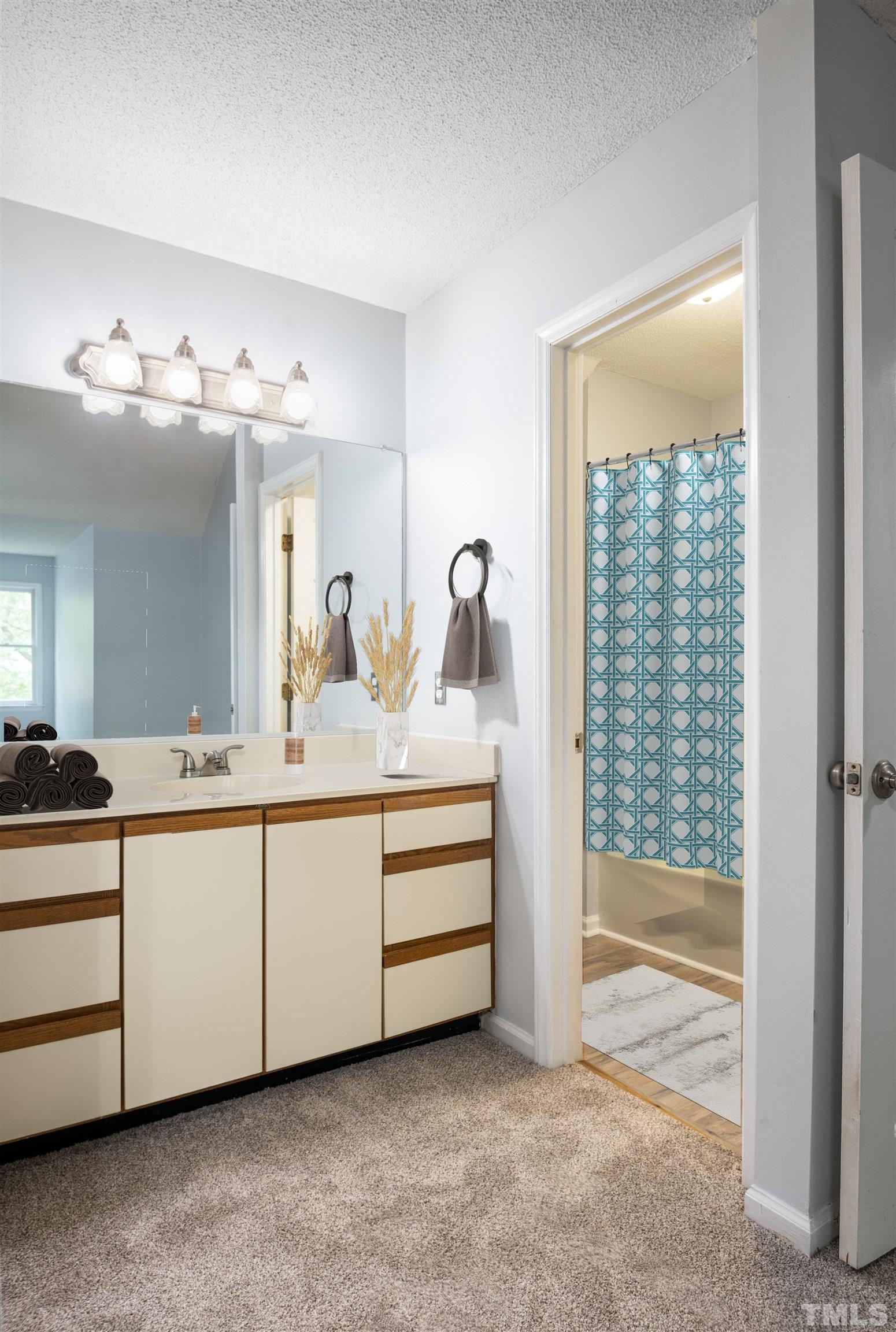 405 Oak Run Drive Raleigh, NC 27606 - Photo 38 of 83 a bathroom with a double vanity sink and a mirror