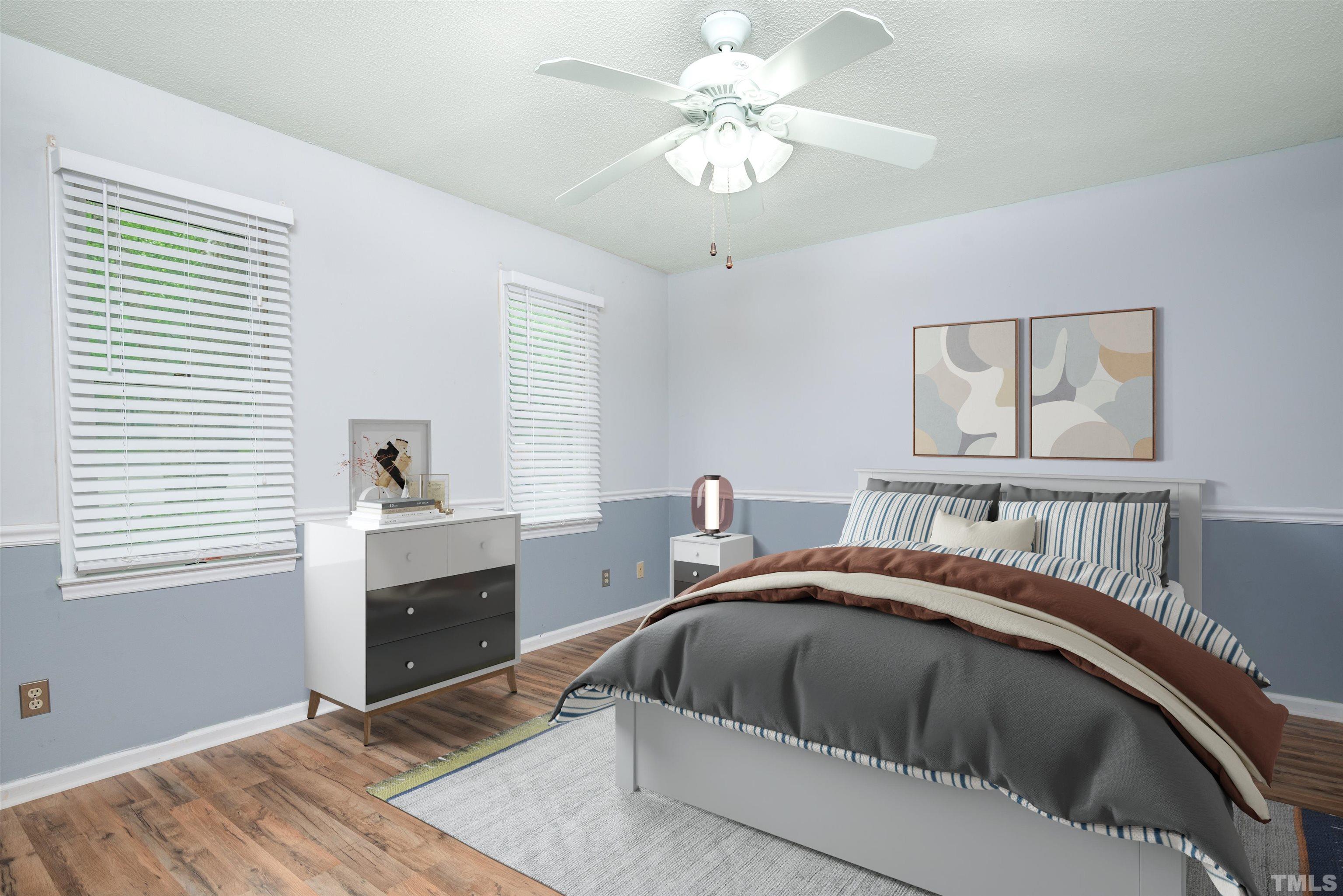 405 Oak Run Drive Raleigh, NC 27606 - Photo 41 of 83 a bedroom with a bed and a window