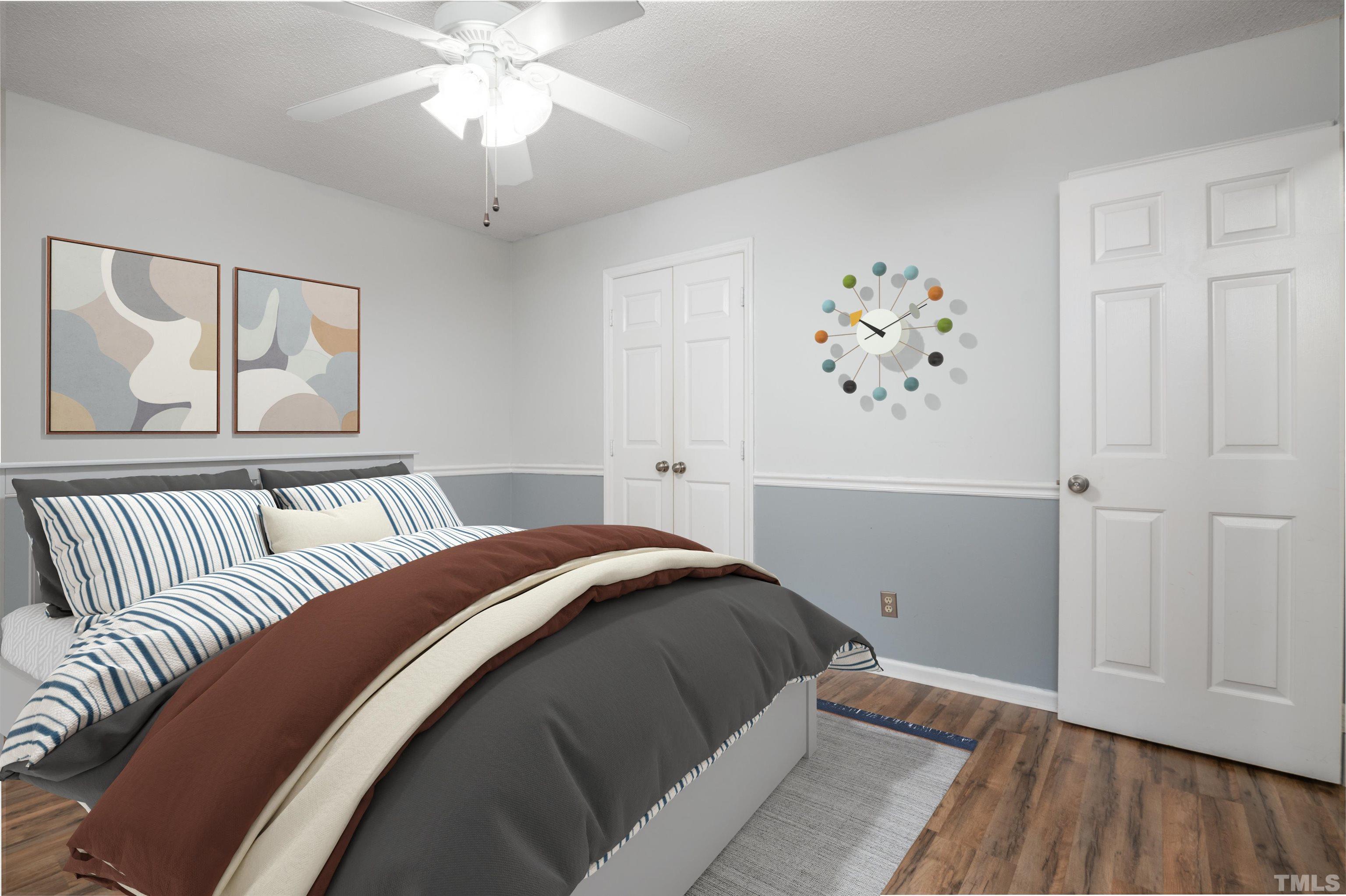 405 Oak Run Drive Raleigh, NC 27606 - Photo 43 of 83 a bedroom with a large bed and a chandelier