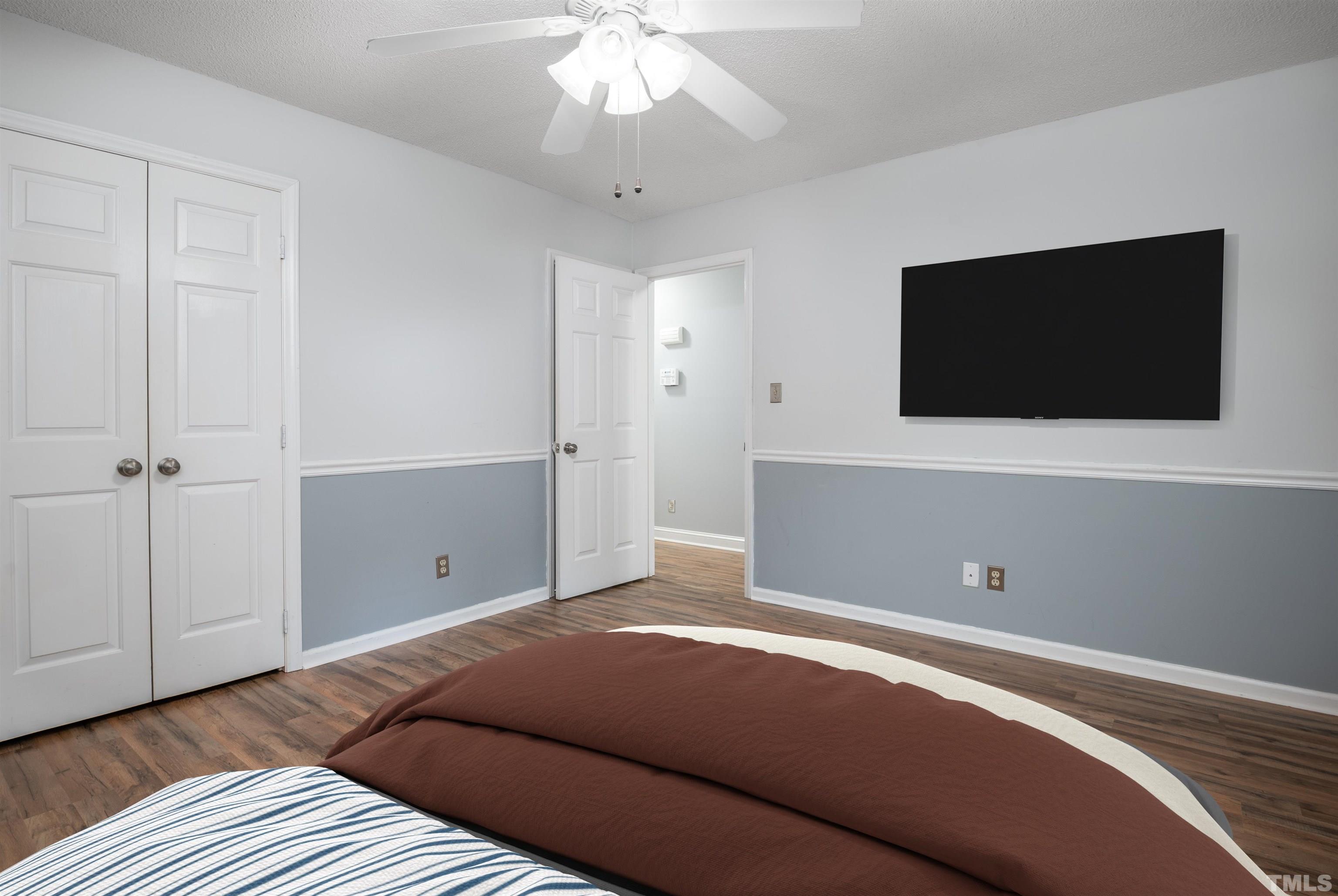 405 Oak Run Drive Raleigh, NC 27606 - Photo 45 of 83 a bedroom with a bed and a flat screen tv