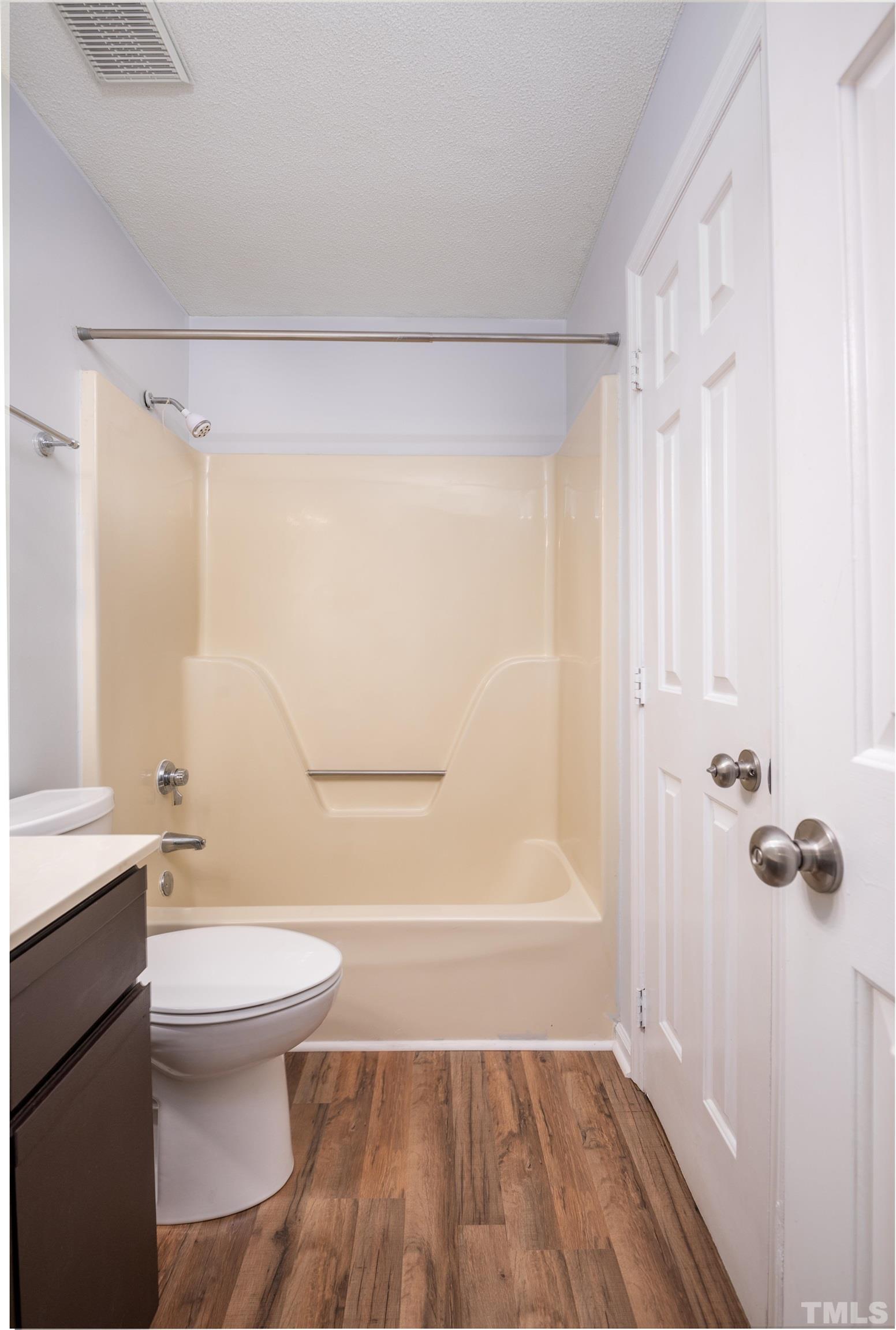 405 Oak Run Drive Raleigh, NC 27606 - Photo 52 of 83 a bathroom with a granite countertop bathtub shower sink vanity and toilet