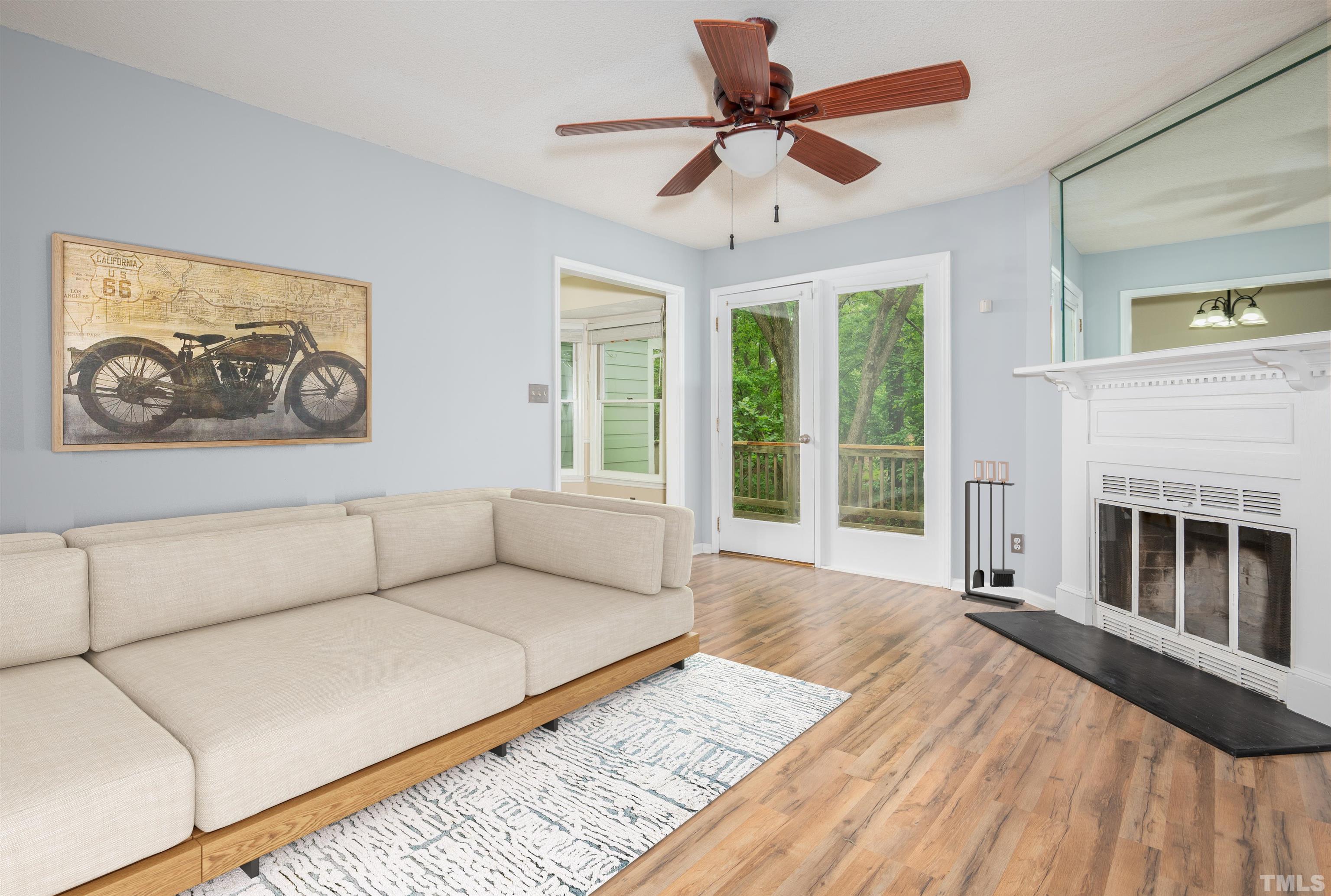 405 Oak Run Drive Raleigh, NC 27606 - Photo 6 of 83 a living room with furniture a window and a fireplace