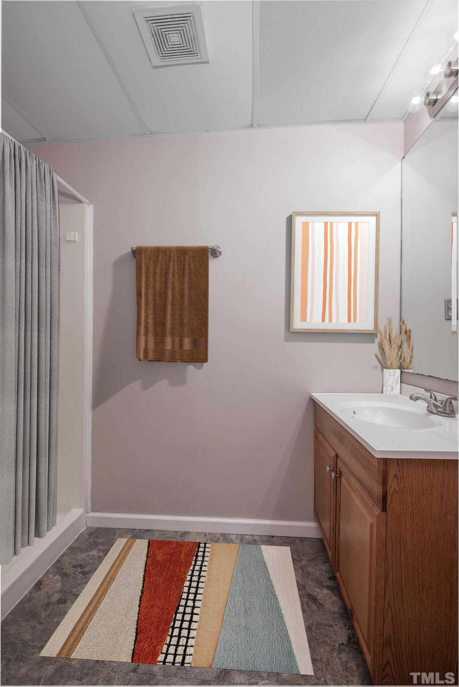 405 Oak Run Drive Raleigh, NC 27606 - Photo 67 of 83 a bathroom with a sink and a mirror