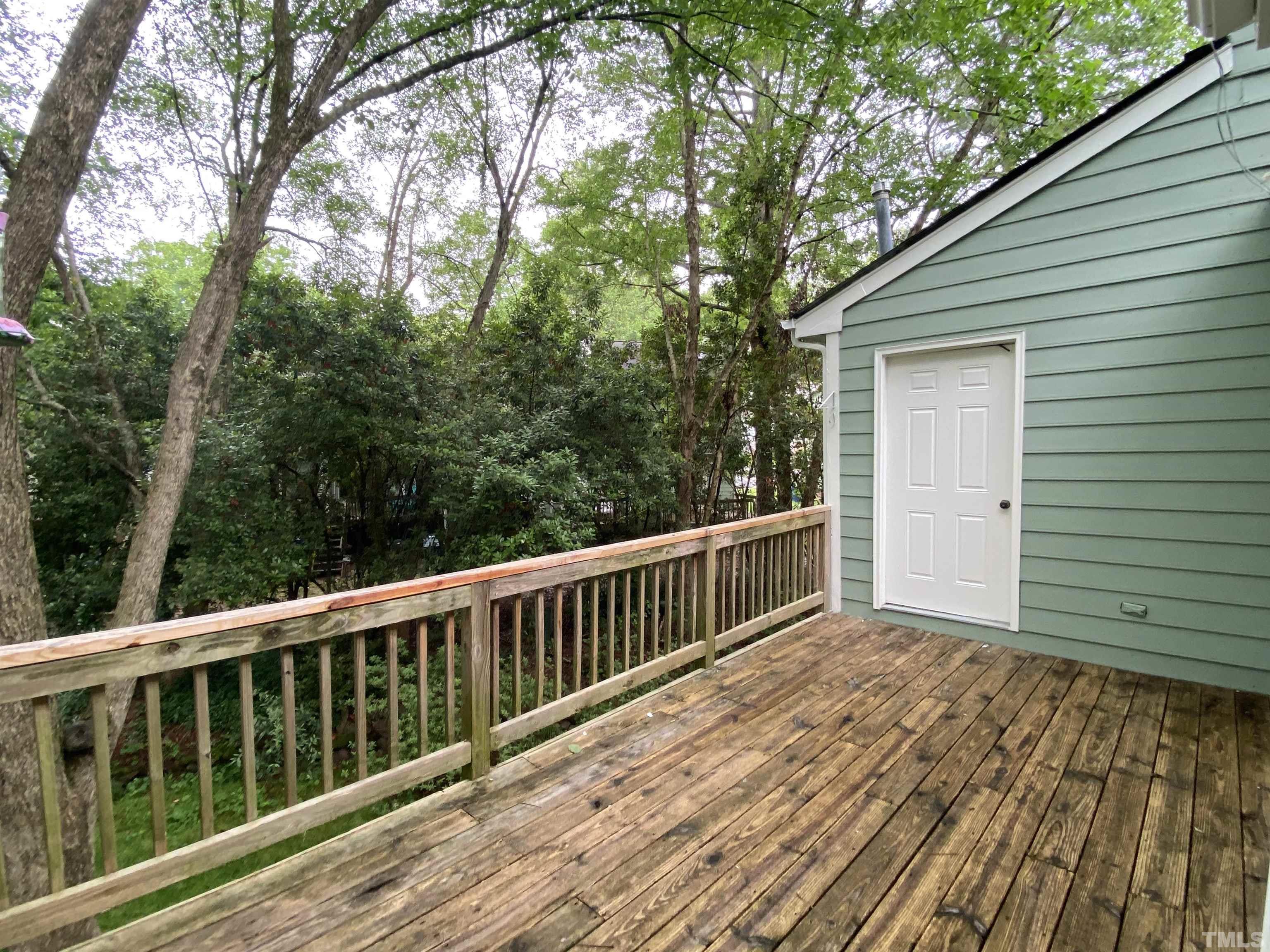405 Oak Run Drive Raleigh, NC 27606 - Photo 72 of 83 1st Floor Rear Deck Looking at Storage Area that has Hot Water Heater. (NEW Hot Water Heater)