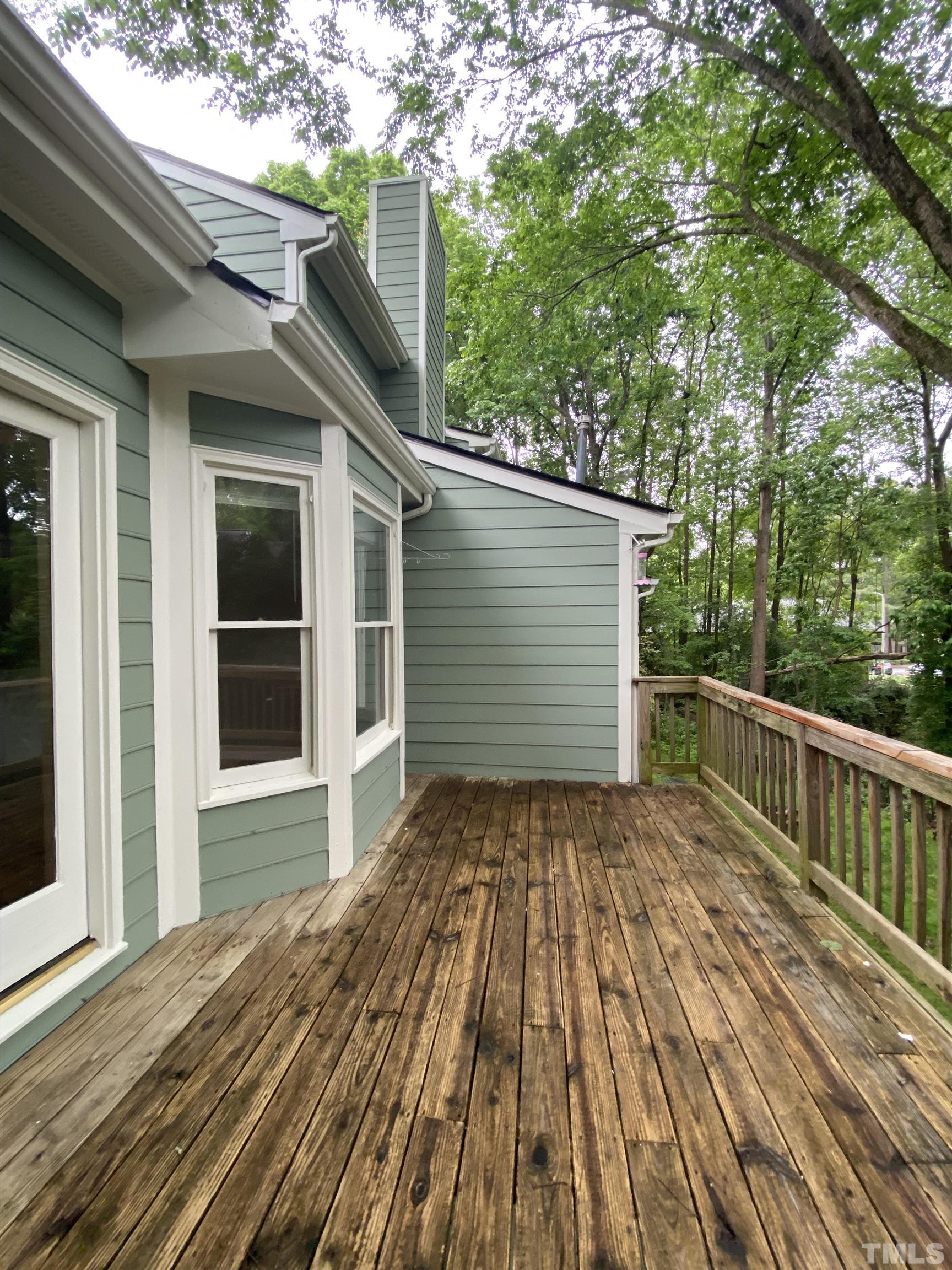 405 Oak Run Drive Raleigh, NC 27606 - Photo 75 of 83 a view of backyard with wooden deck and trees