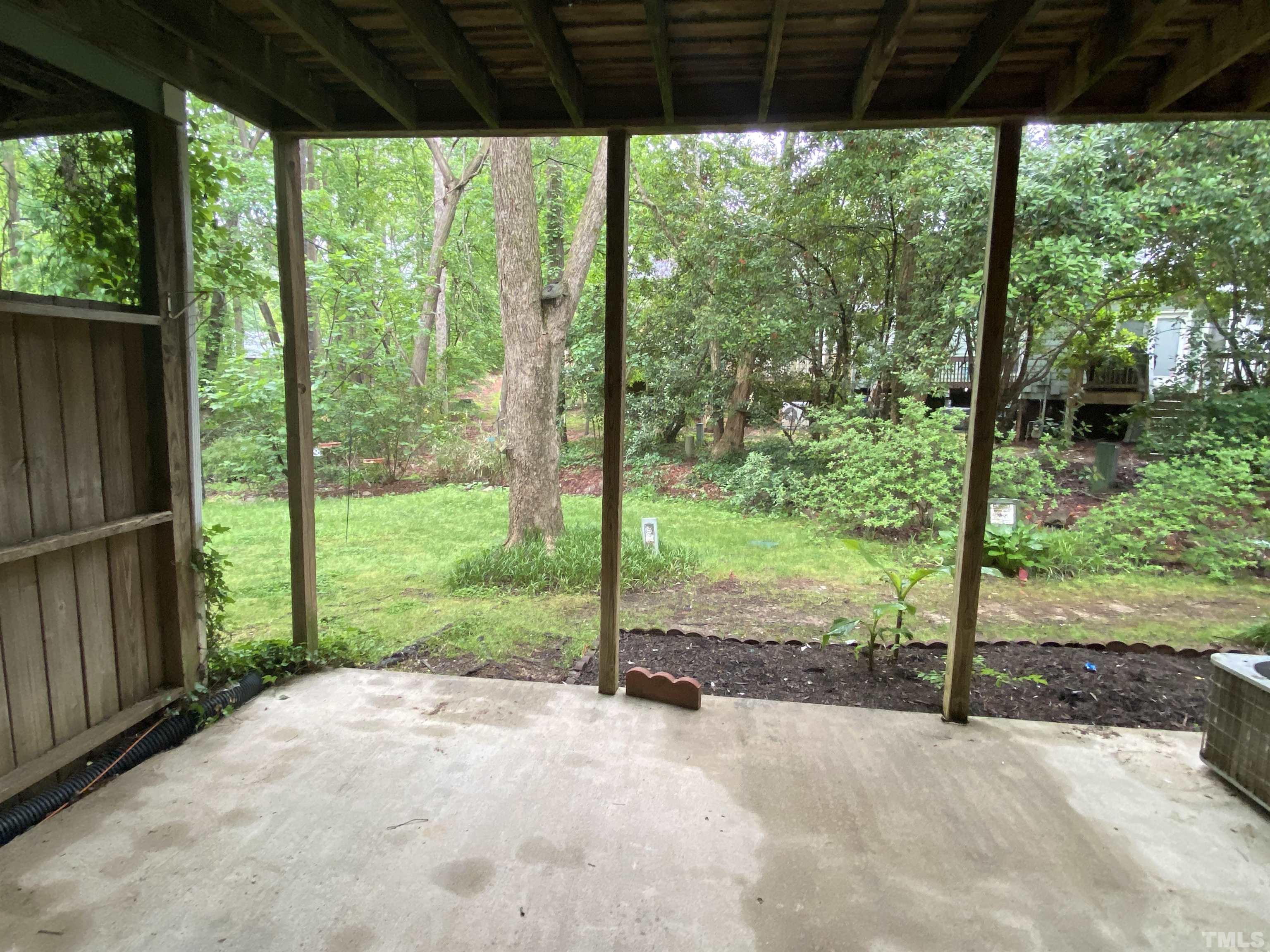 405 Oak Run Drive Raleigh, NC 27606 - Photo 76 of 83 a view of a room with porch and trees