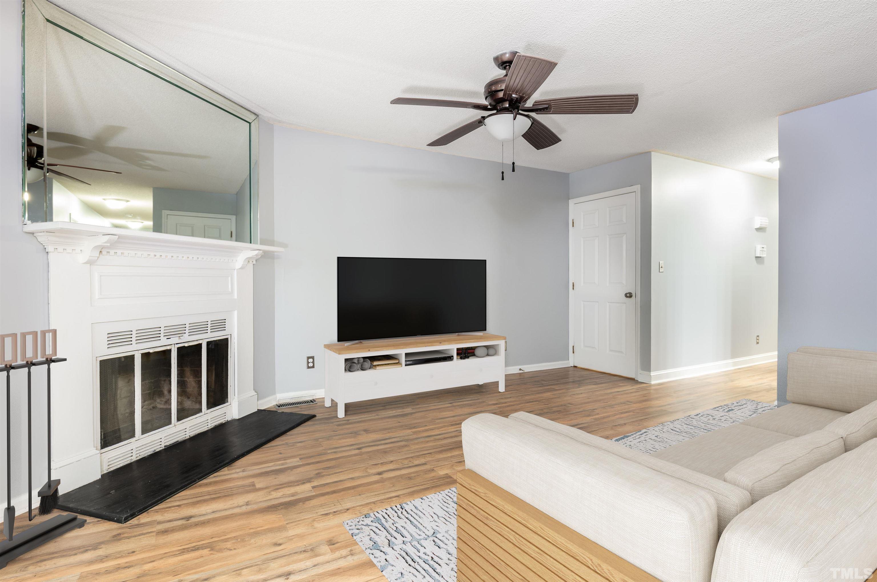 405 Oak Run Drive Raleigh, NC 27606 - Photo 10 of 83 a bedroom with a bed and a flat screen tv