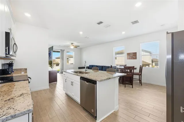 a kitchen with a stove and a refrigerator