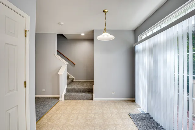 a view of entryway and hall with a window