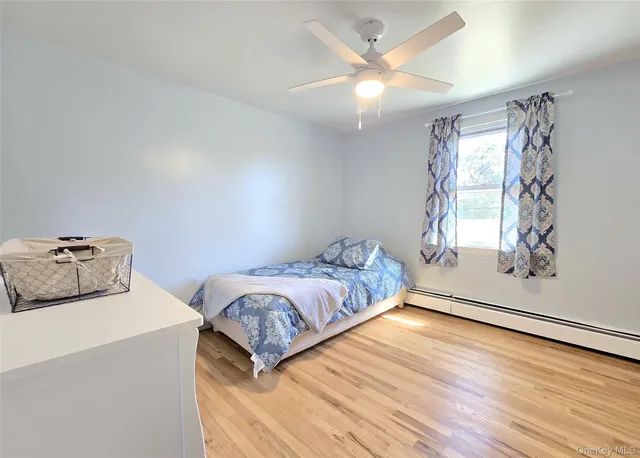 a bedroom with bed and window