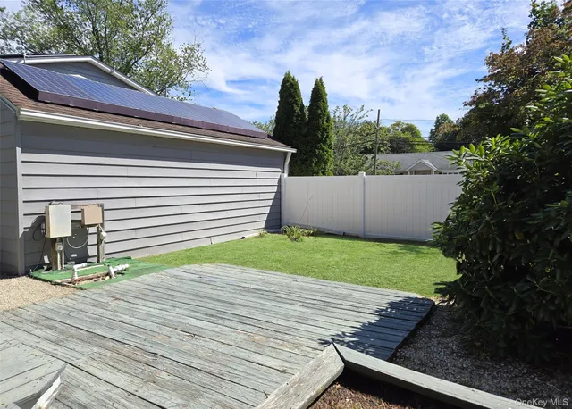 a view of a backyard with sitting area