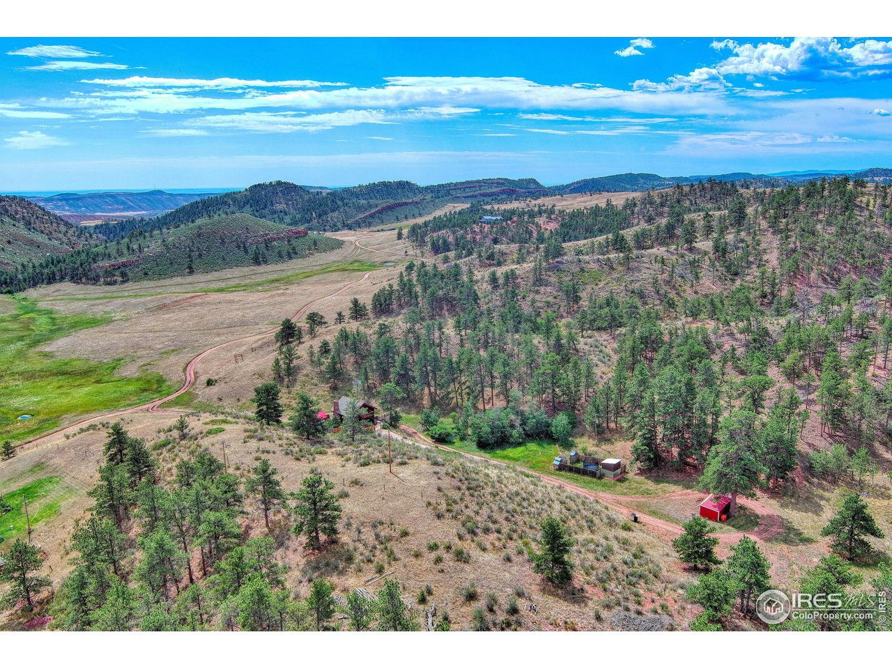 1761 Redbluff Road Livermore, CO 80536 - Photo 12 of 40 Aerial of the property looking to the east and to Soapstone Prairie in the distance