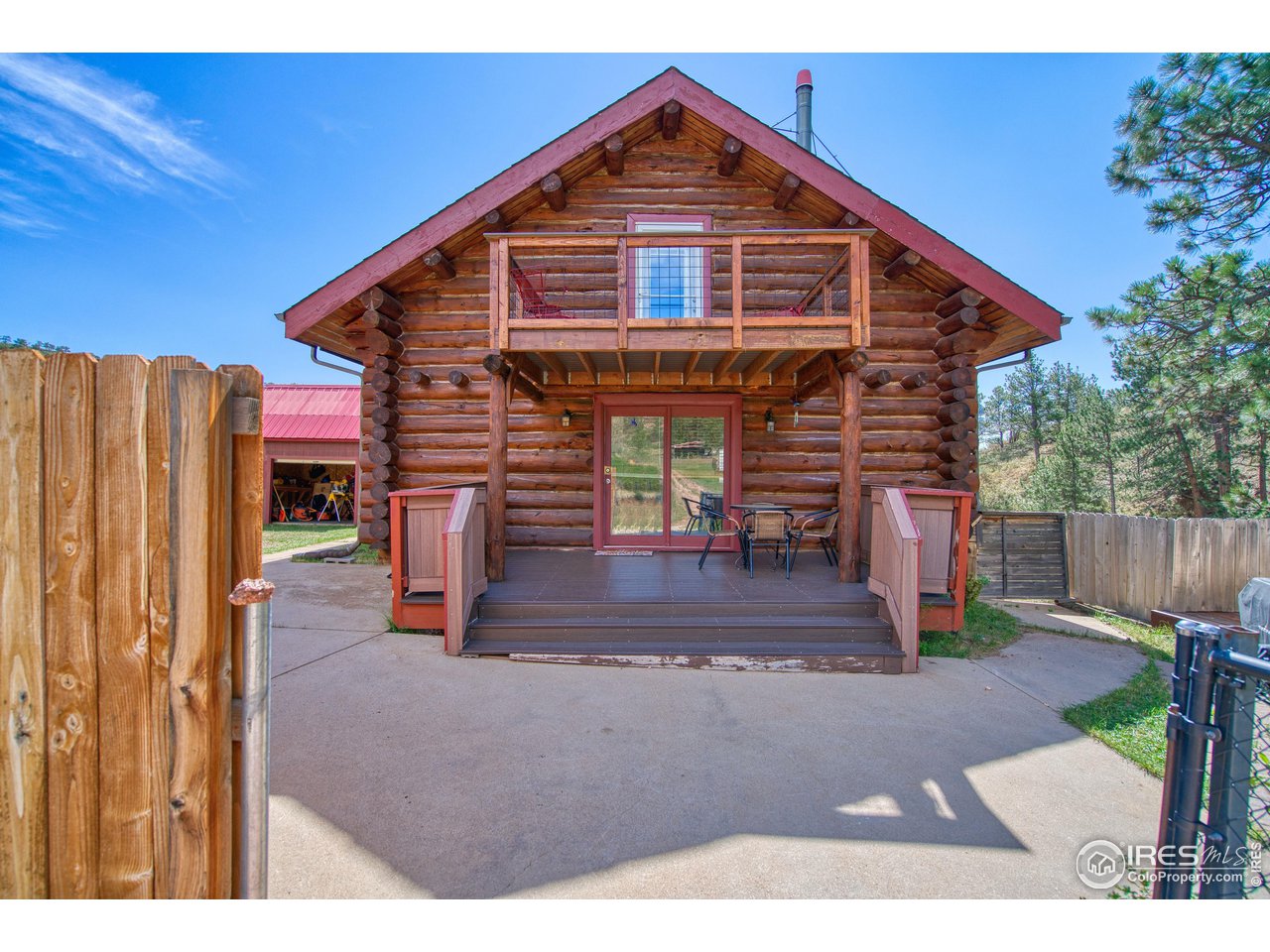 1761 Redbluff Road Livermore, CO 80536 - Photo 35 of 40 Front of cabin inside of compound gate