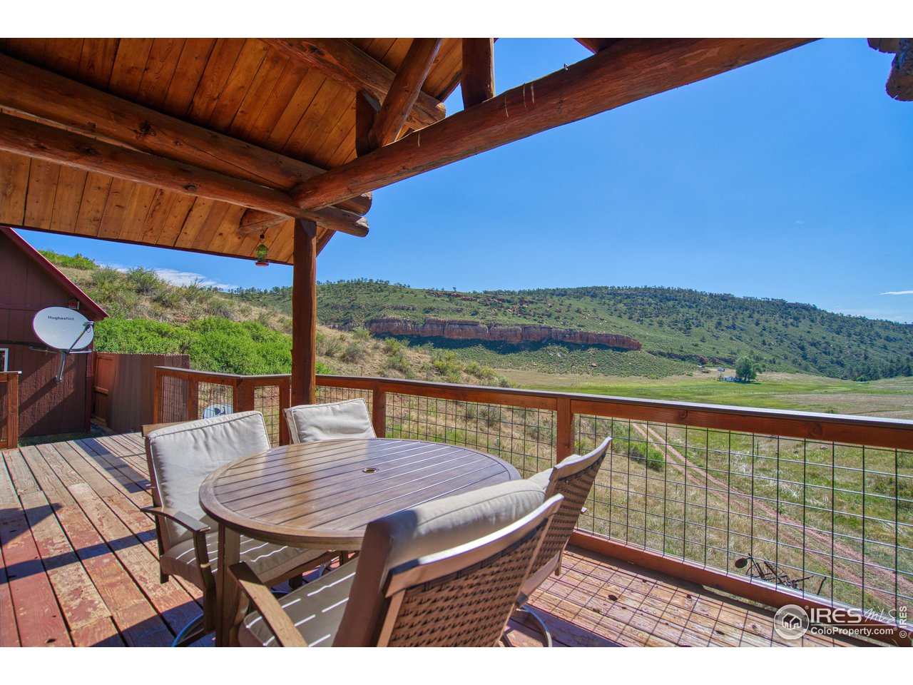 1761 Redbluff Road Livermore, CO 80536 - Photo 10 of 40 Main deck looking over the prairie/meadow and onto Red Mountain Open Space