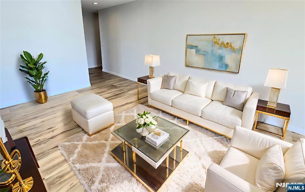 151 Prospect Avenue, Unit 19A Hackensack, NJ 07601 - Photo 5 of 17 a living room with furniture