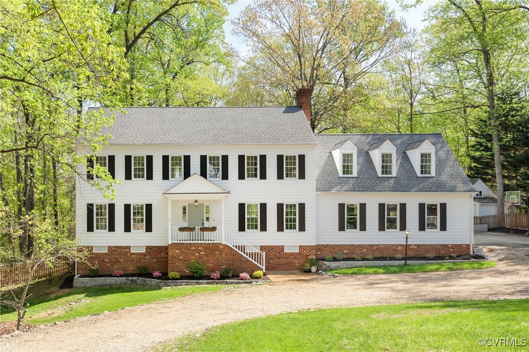 3001 Winterfield Road Midlothian, VA 23113 - Photo 1 of 50 a view of a white house with a big yard and large trees
