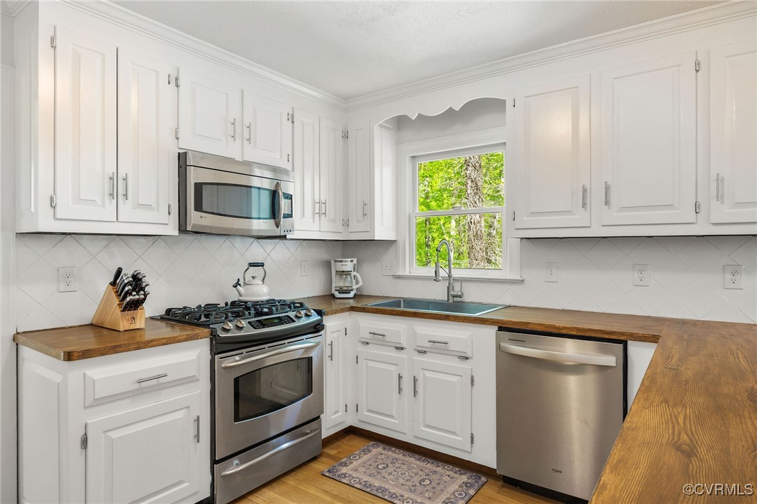 3001 Winterfield Road Midlothian, VA 23113 - Photo 17 of 50 a kitchen with granite countertop white cabinets and white appliances