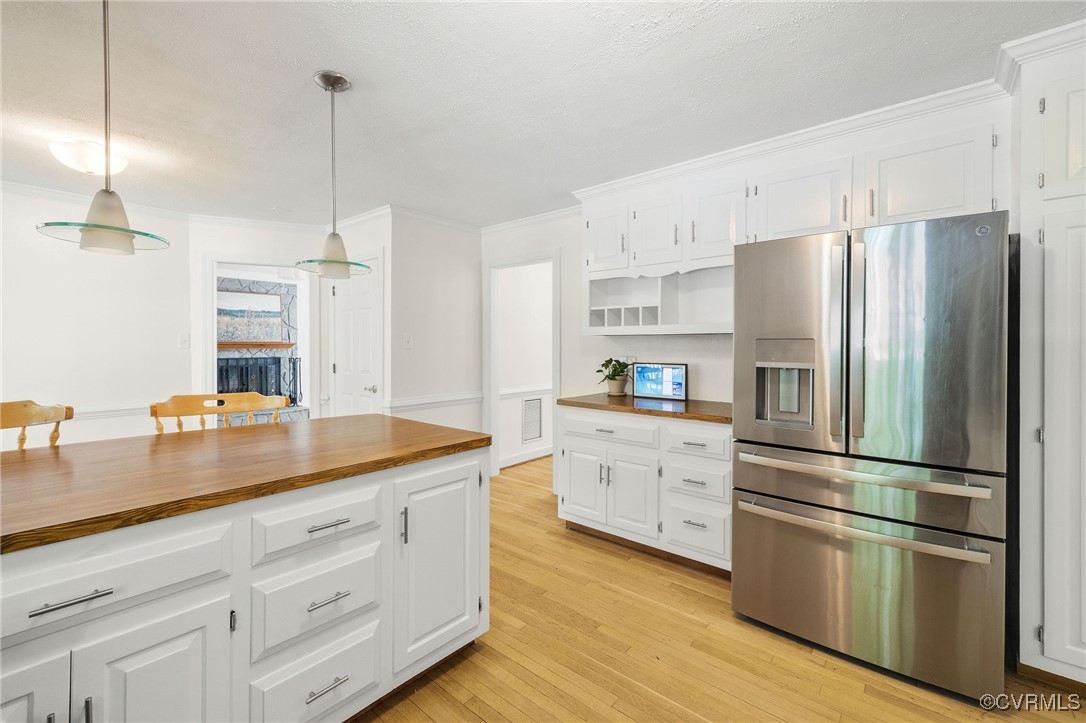 3001 Winterfield Road Midlothian, VA 23113 - Photo 18 of 50 a kitchen with stainless steel appliances granite countertop a refrigerator a sink and white cabinets
