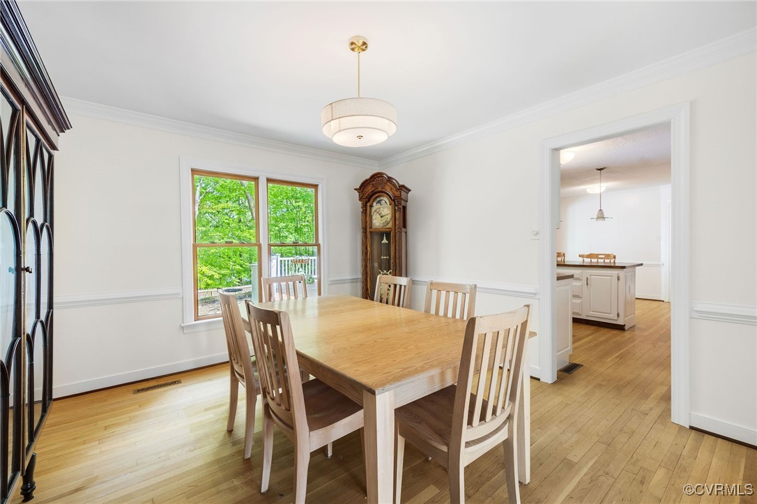 3001 Winterfield Road Midlothian, VA 23113 - Photo 19 of 50 a view of a dining room with furniture window and wooden floor