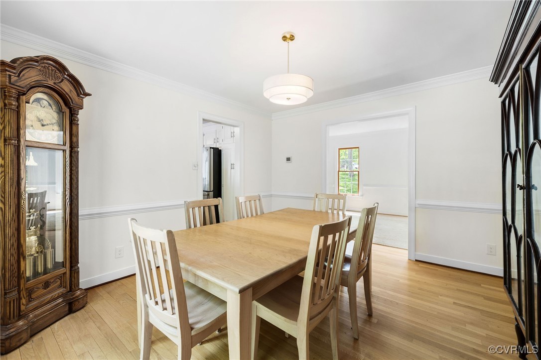 3001 Winterfield Road Midlothian, VA 23113 - Photo 20 of 50 a view of a dining room with furniture and wooden floor