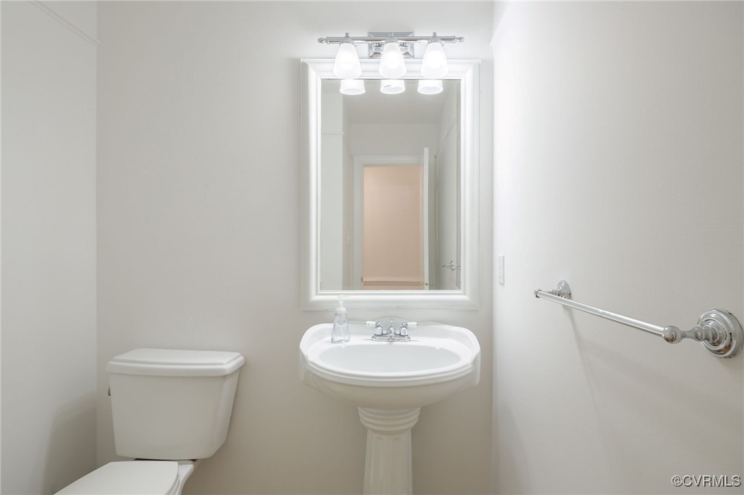 3001 Winterfield Road Midlothian, VA 23113 - Photo 22 of 50 a bathroom with a sink and mirror