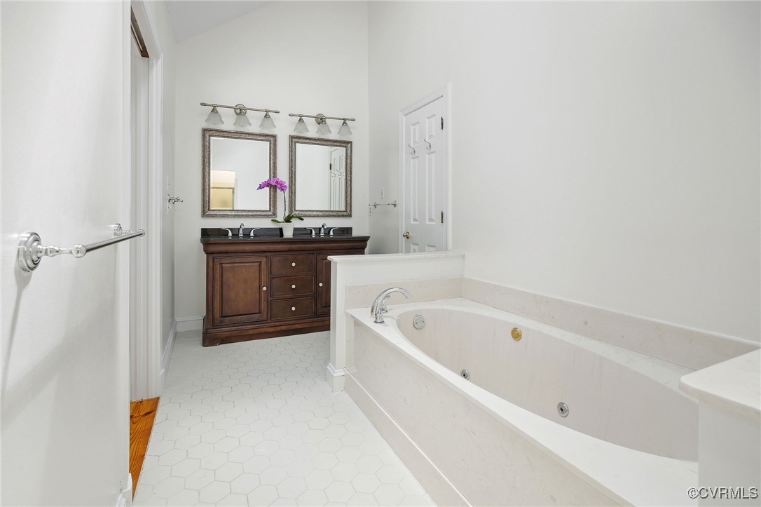 3001 Winterfield Road Midlothian, VA 23113 - Photo 25 of 50 a spacious bathroom with a tub sink shower and mirror