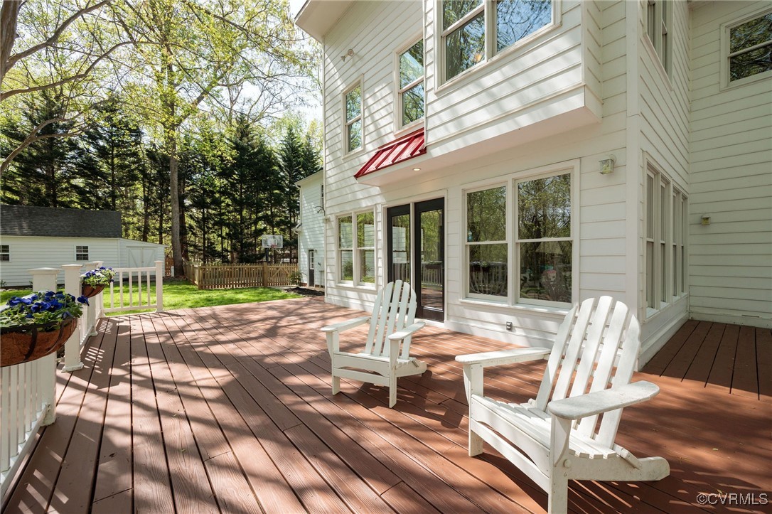 3001 Winterfield Road Midlothian, VA 23113 - Photo 41 of 50 a view of a patio with table and chairs next to a yard