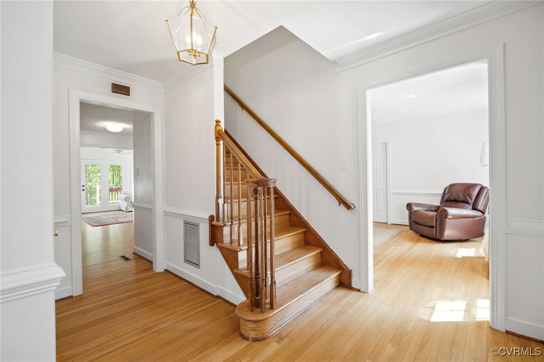3001 Winterfield Road Midlothian, VA 23113 - Photo 6 of 50 a view of a hallway with wooden floor and staircase