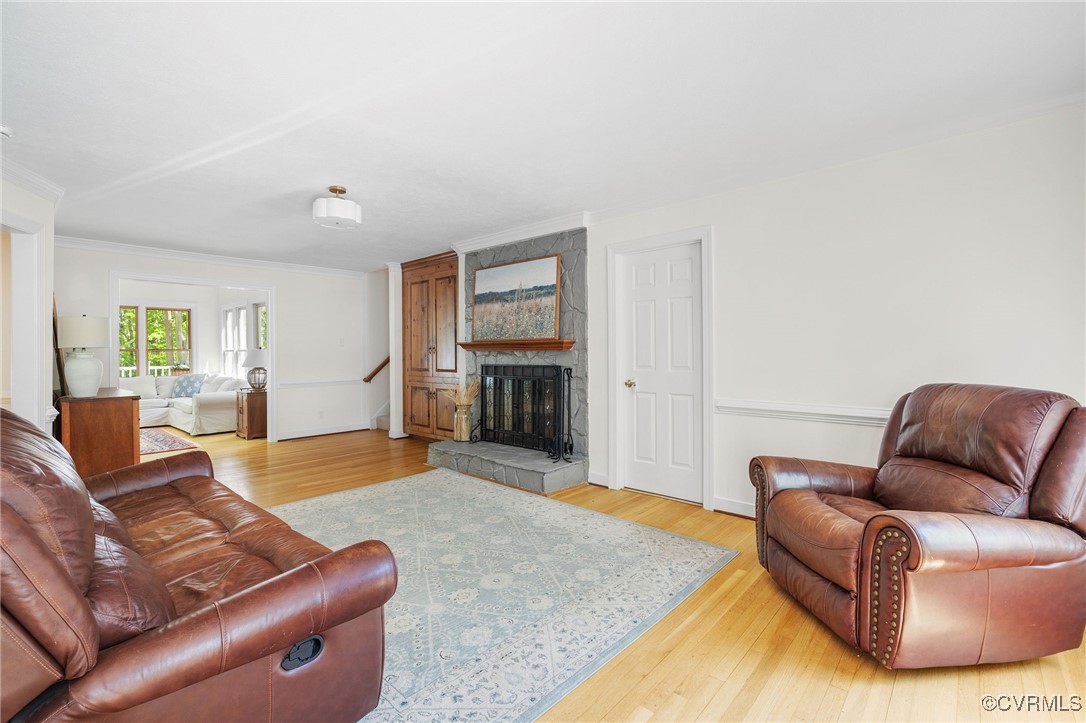 3001 Winterfield Road Midlothian, VA 23113 - Photo 8 of 50 a living room with furniture and a fireplace