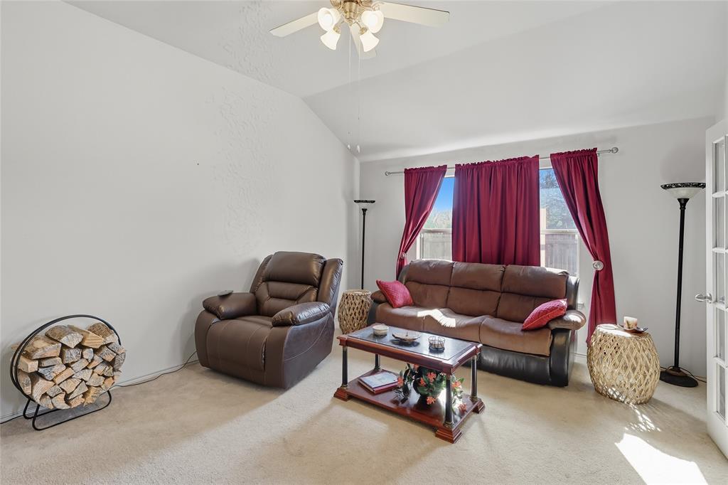 2708 Stockton Street Denton, TX 76209 - Photo 16 of 40 a living room with furniture a couch and a chandelier
