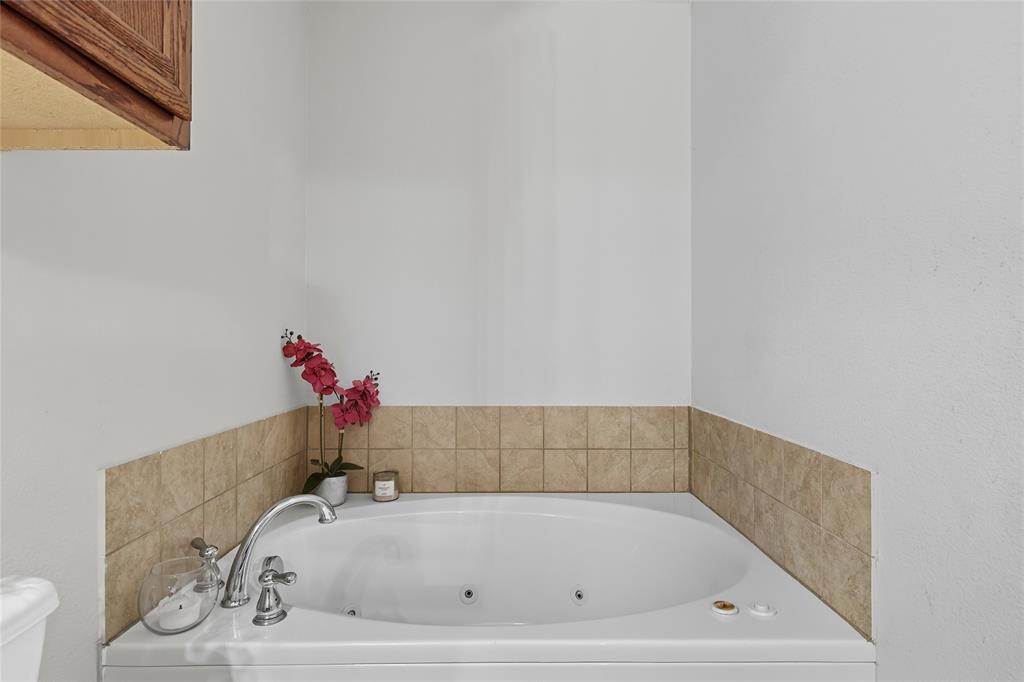 2708 Stockton Street Denton, TX 76209 - Photo 21 of 40 a bathroom with a bathtub