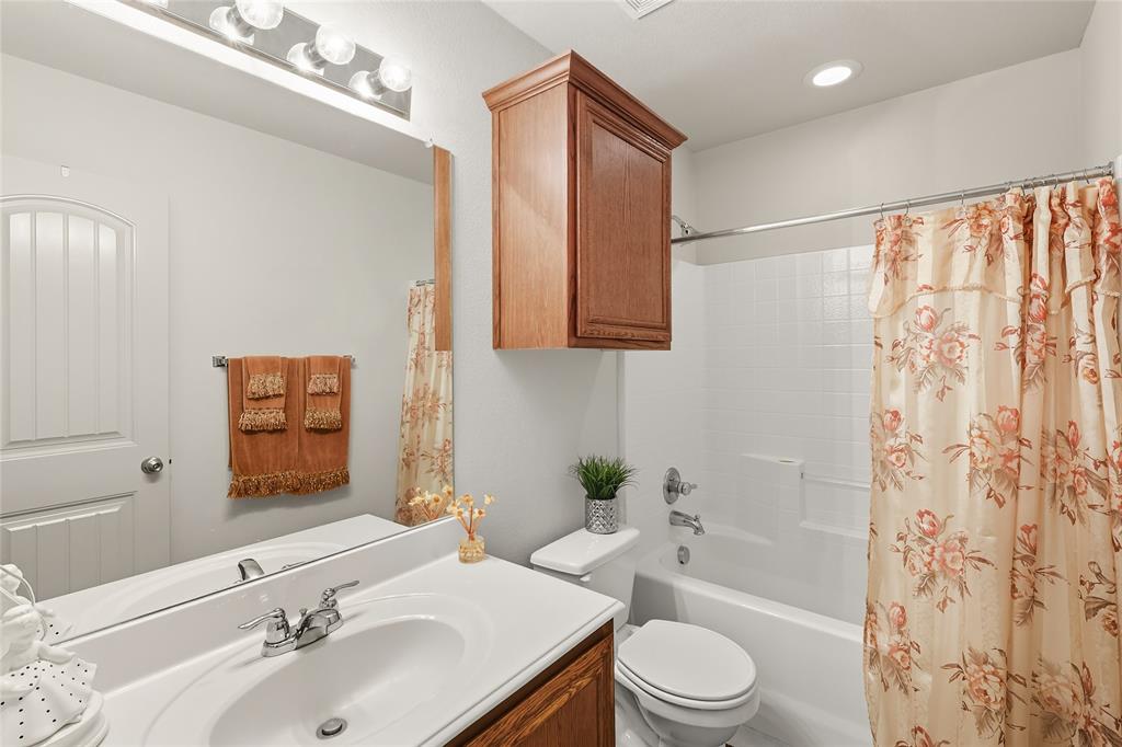 2708 Stockton Street Denton, TX 76209 - Photo 24 of 40 a bathroom with a sink toilet and shower
