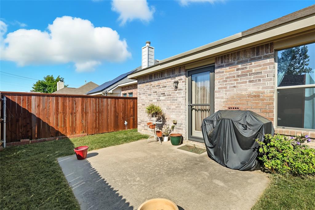 2708 Stockton Street Denton, TX 76209 - Photo 27 of 40 a backyard of a house with barbeque oven