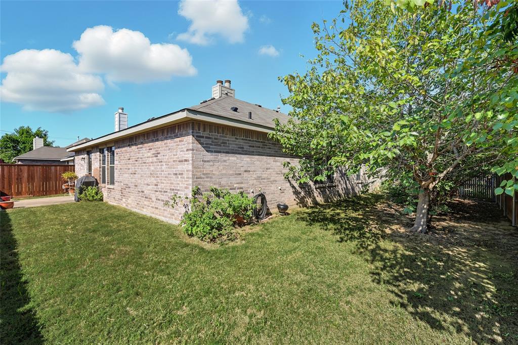 2708 Stockton Street Denton, TX 76209 - Photo 30 of 40 a view of a backyard with plants and large trees
