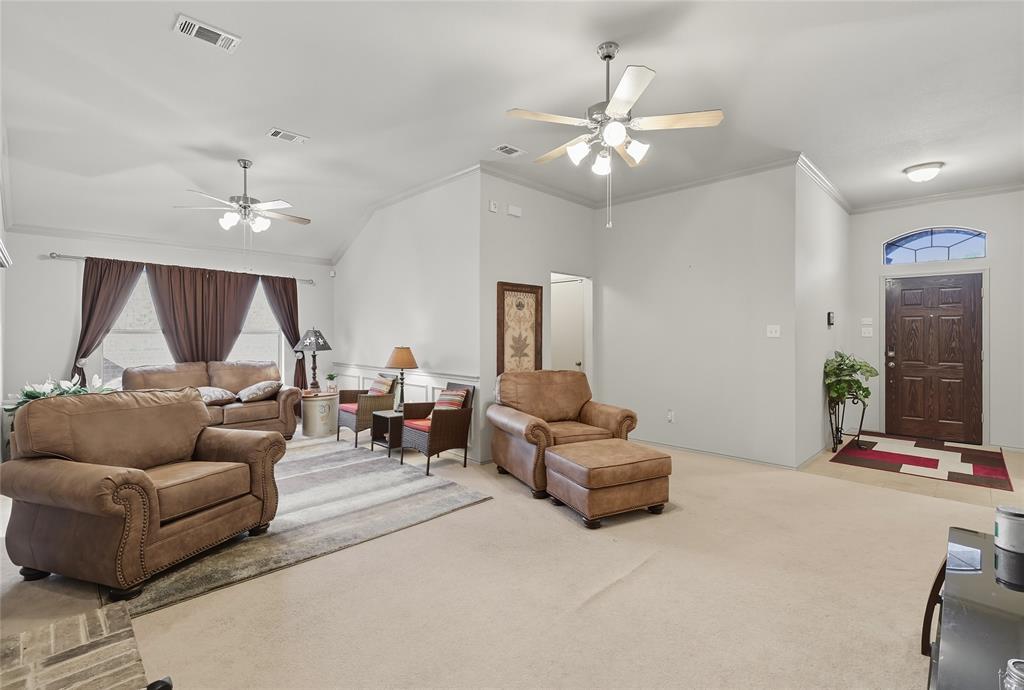 2708 Stockton Street Denton, TX 76209 - Photo 6 of 40 a living room with furniture and a chandelier