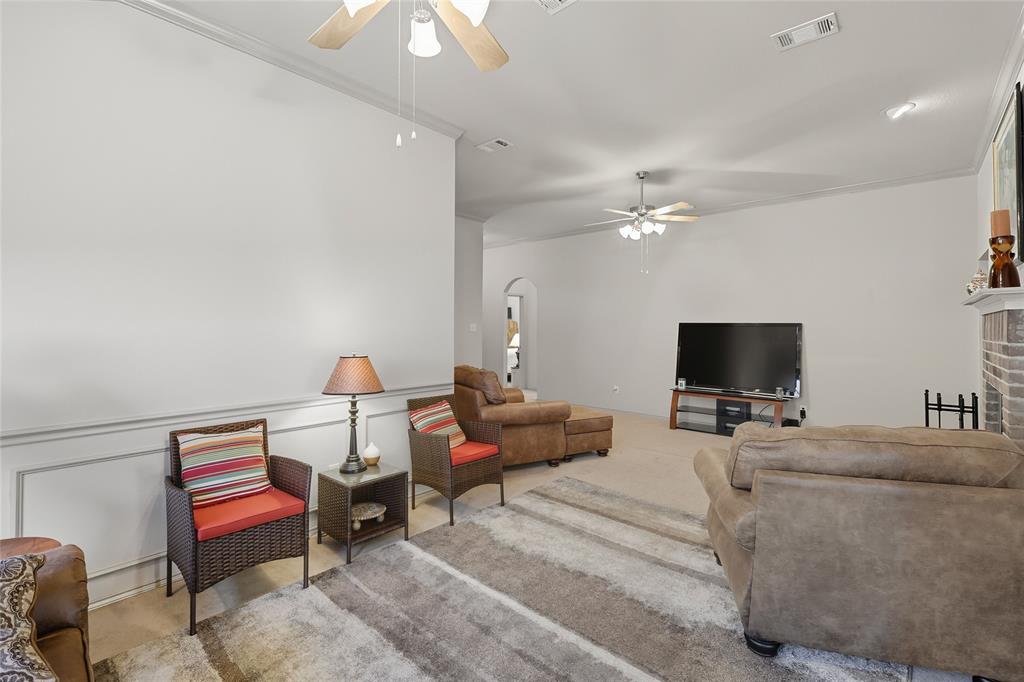 2708 Stockton Street Denton, TX 76209 - Photo 8 of 40 a bedroom with a bed and a chandelier