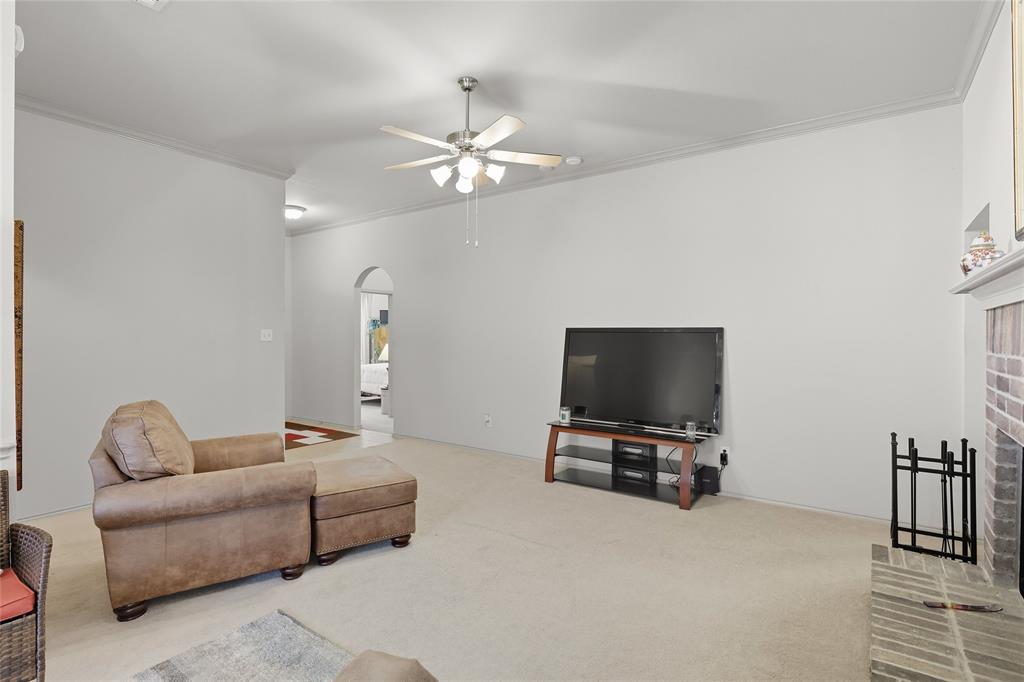 2708 Stockton Street Denton, TX 76209 - Photo 9 of 40 a living room with furniture and a flat screen tv