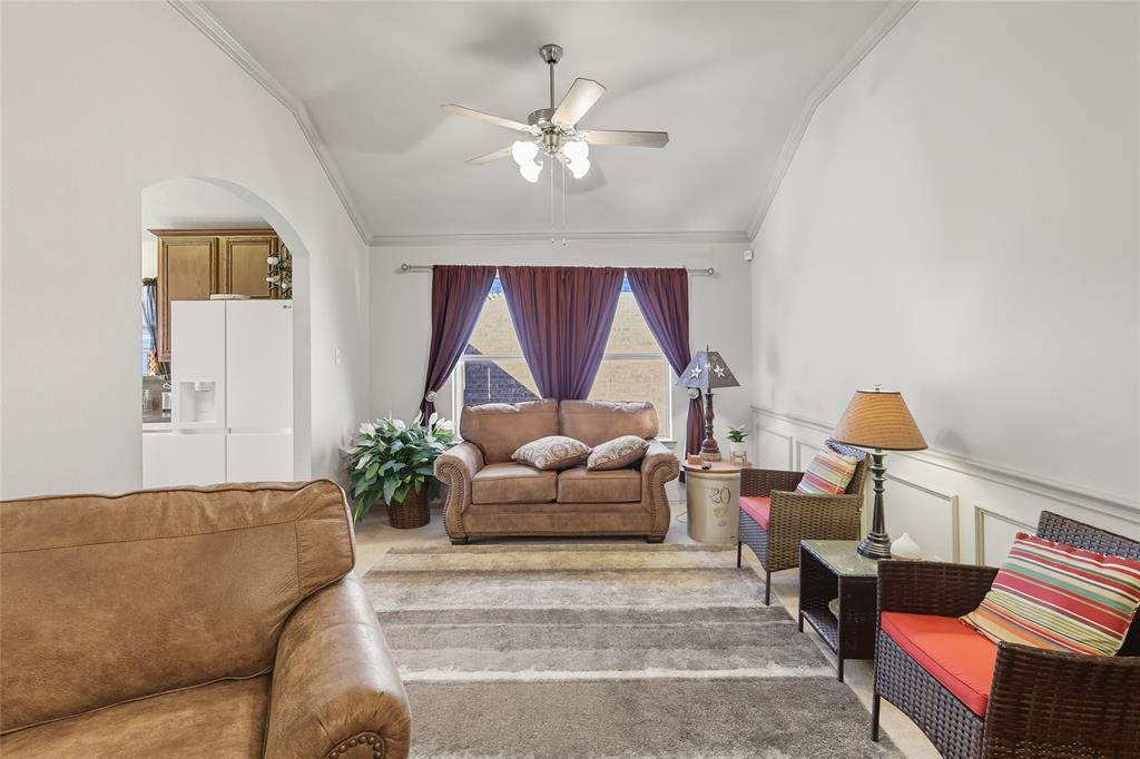 2708 Stockton Street Denton, TX 76209 - Photo 10 of 40 a living room with furniture and a chandelier