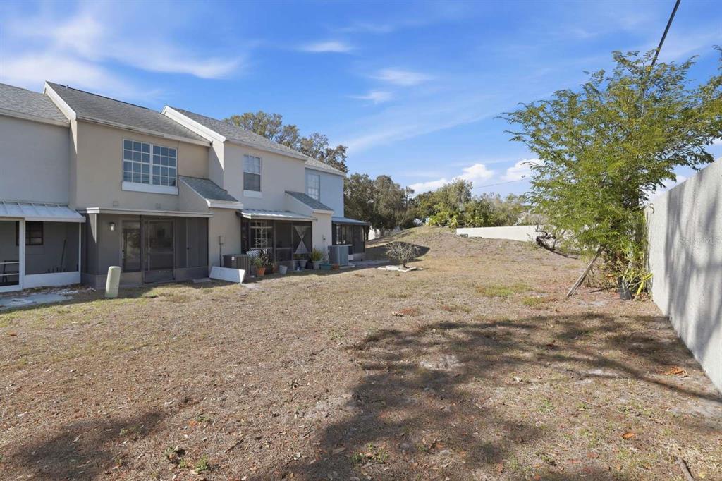 6600 121st Avenue, Unit 3 Largo, FL 33773 - Photo 26 of 27 a view of a street with a house in the background