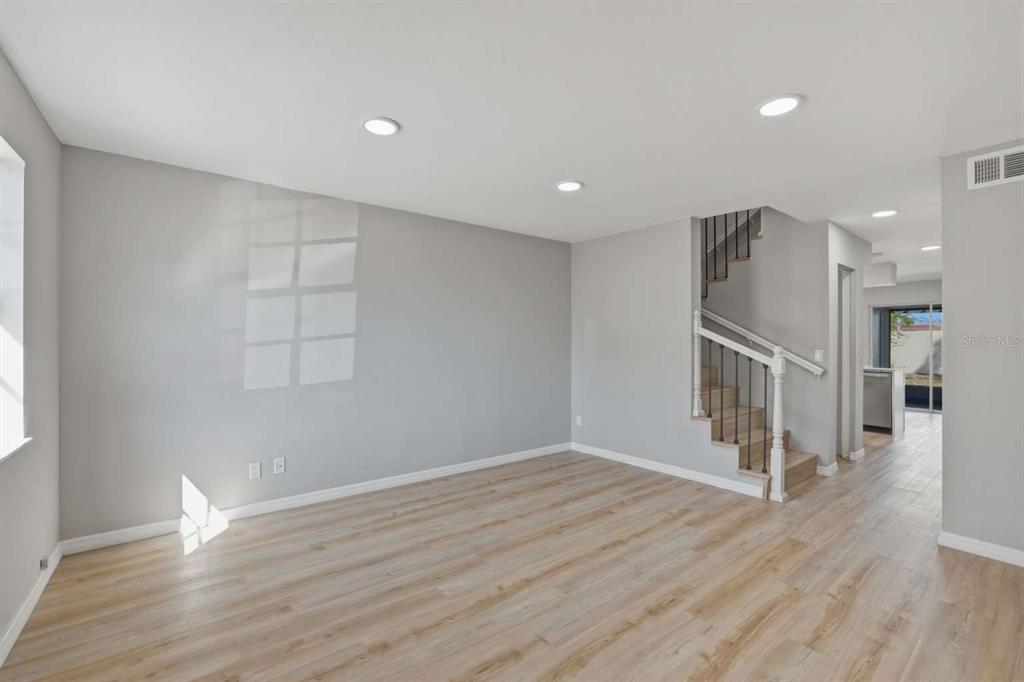 6600 121st Avenue, Unit 3 Largo, FL 33773 - Photo 4 of 27 wooden floor in an empty room with a window