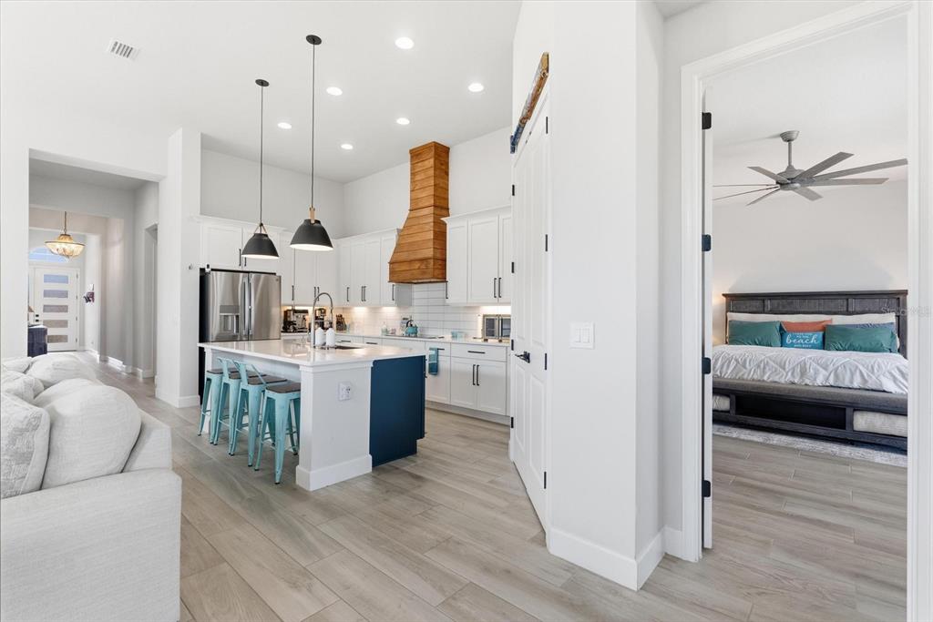 270 Azure Mist Way Daytona Beach, FL 32124 - Photo 23 of 71 a view of kitchen with kitchen island wooden floors appliances and furniture