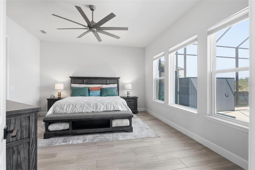 270 Azure Mist Way Daytona Beach, FL 32124 - Photo 24 of 71 a bedroom with a large bed and a large window