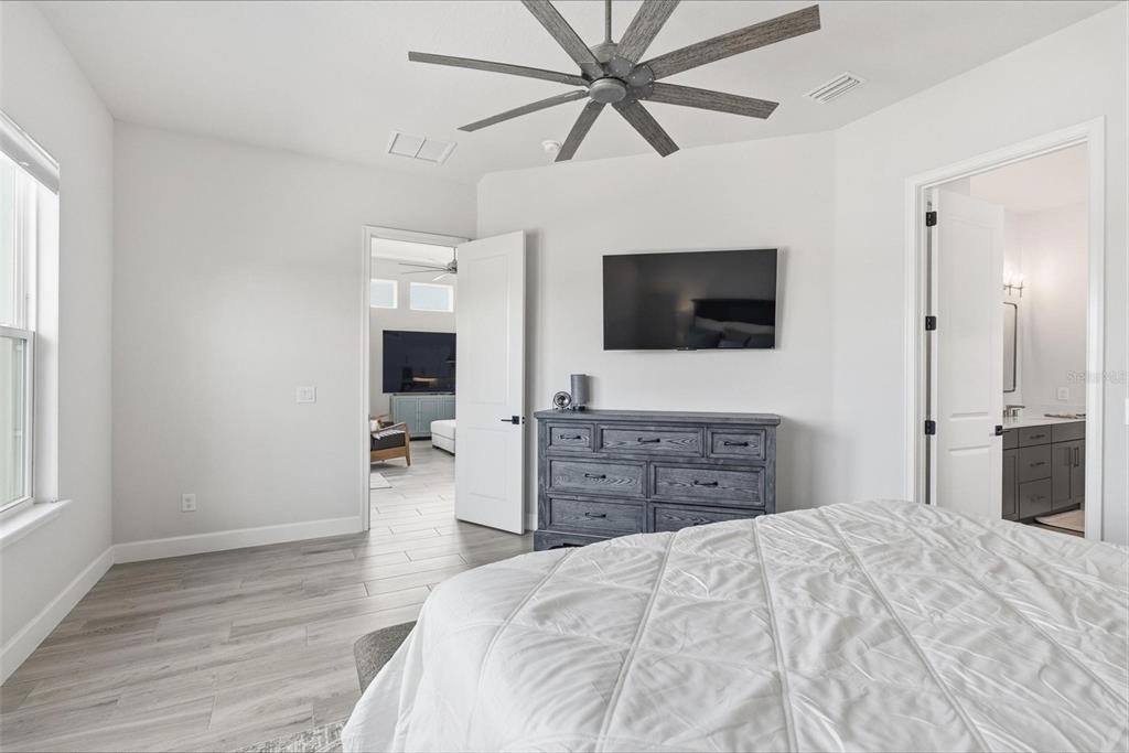 270 Azure Mist Way Daytona Beach, FL 32124 - Photo 26 of 71 a bedroom with a bed and a flat screen tv